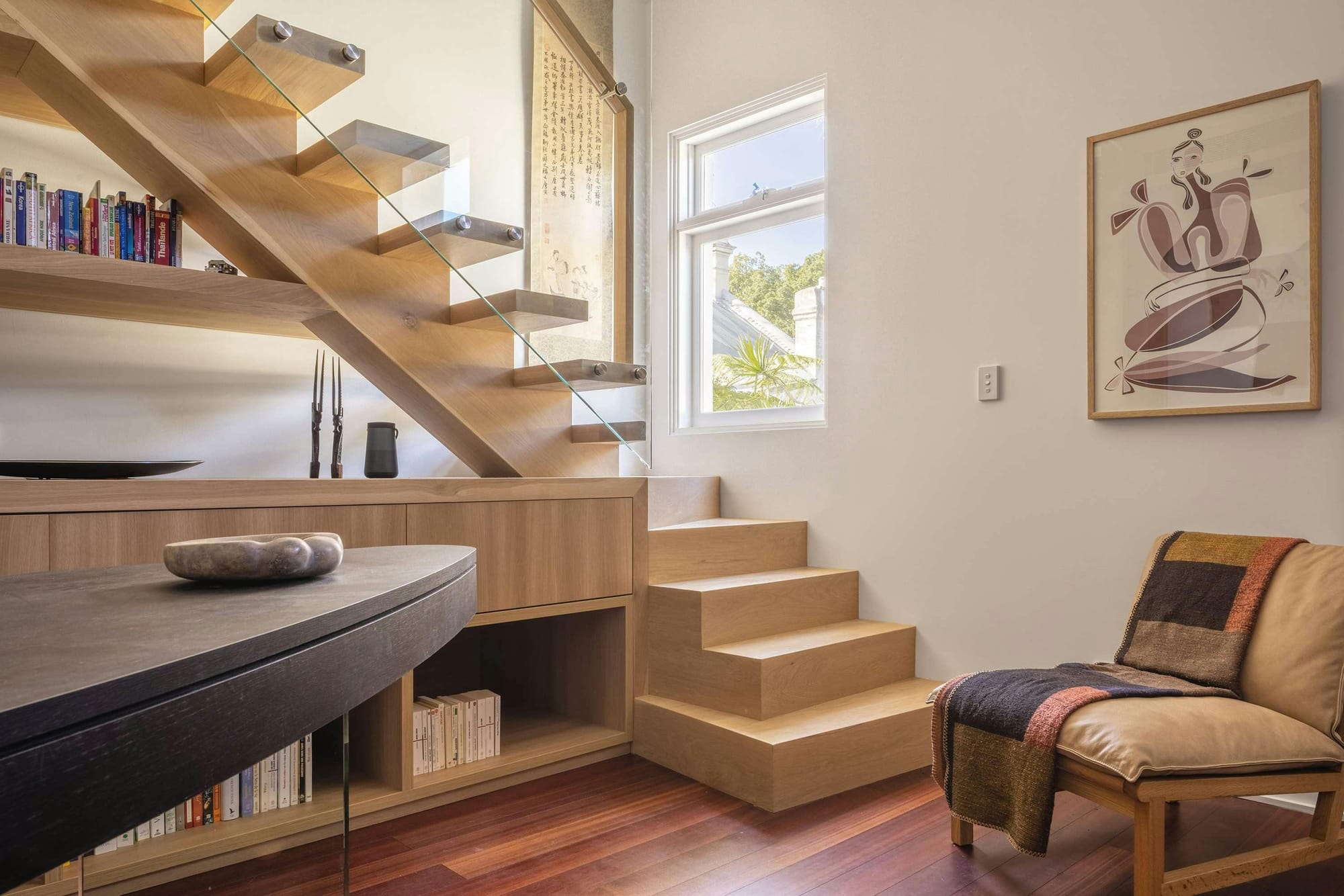 An interior shot of the new timber staircase with storage under