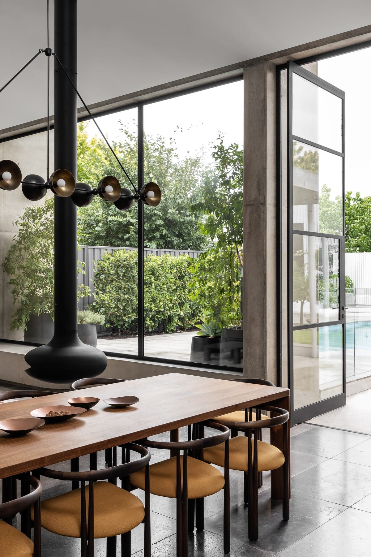 Rose Park by studio gram. Photography by Timothy Ross. Long timber dining table. Floating fireplace.