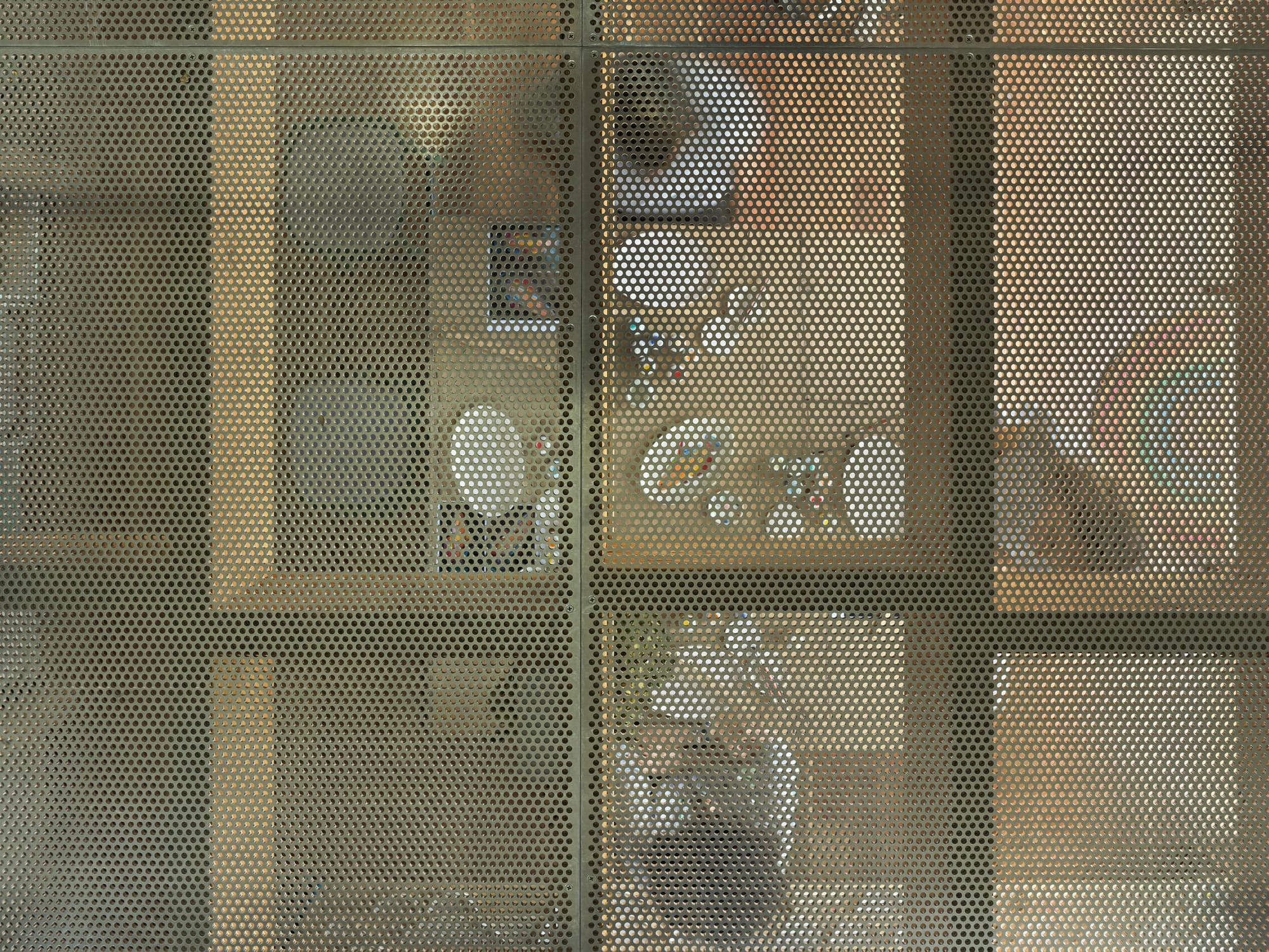 Coconut Crab by Alexander Symes Architect. Photography by Barton Taylor Photography. Overhead shot of craft table underneath perforated aluminium flooring.