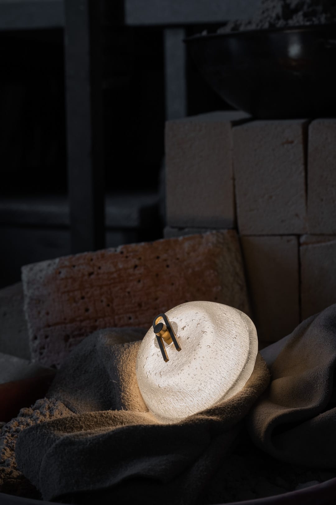 Point Five by South Drawn. Image copyright of South Drawn. Bathroom with two curved wall mirrors, and a column of domes wall sconces emitting warm light on either side of wall.