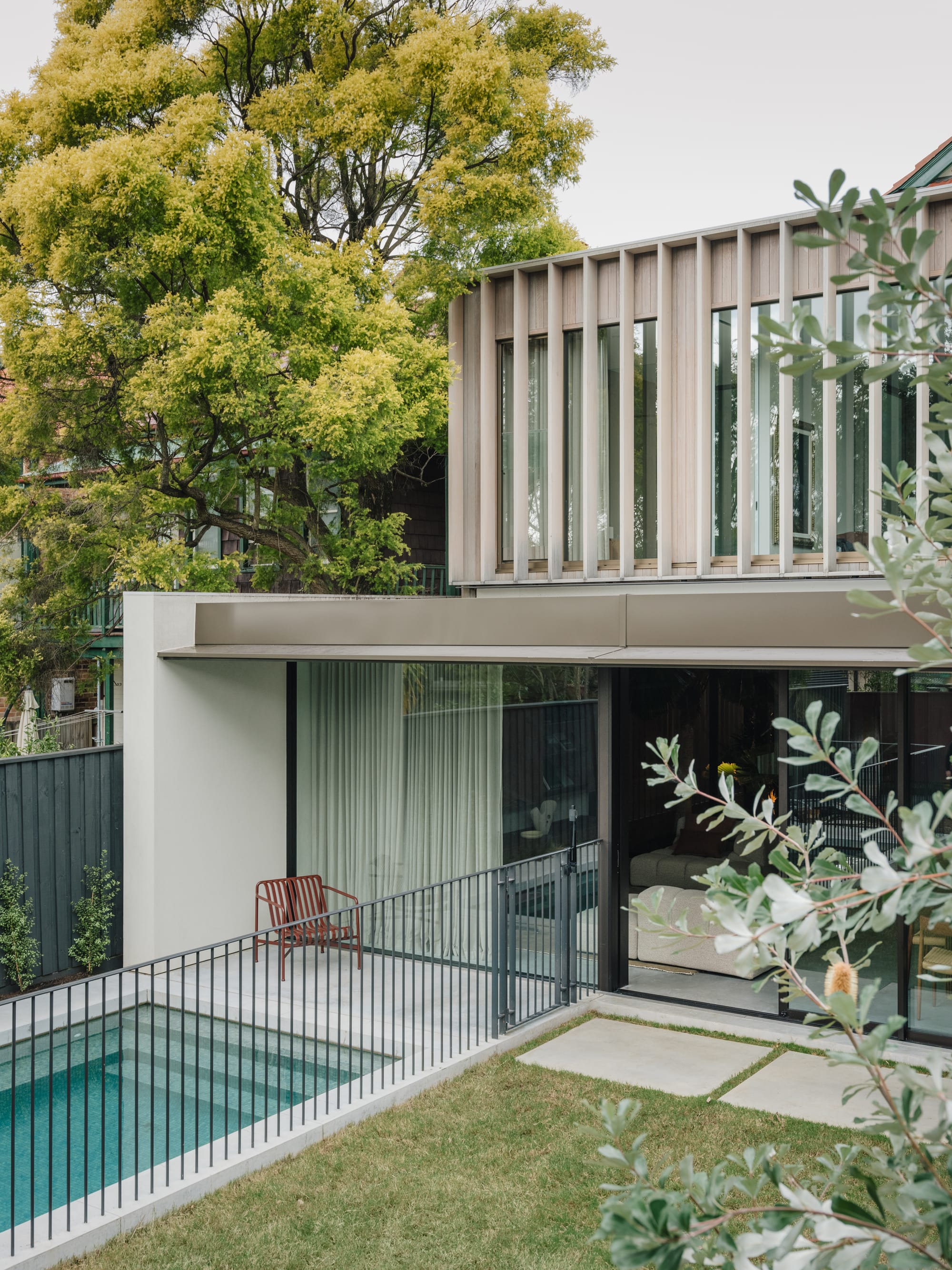 Petersham House by Cateaux Architects showing the rear exterior of the house and backyard pool.
