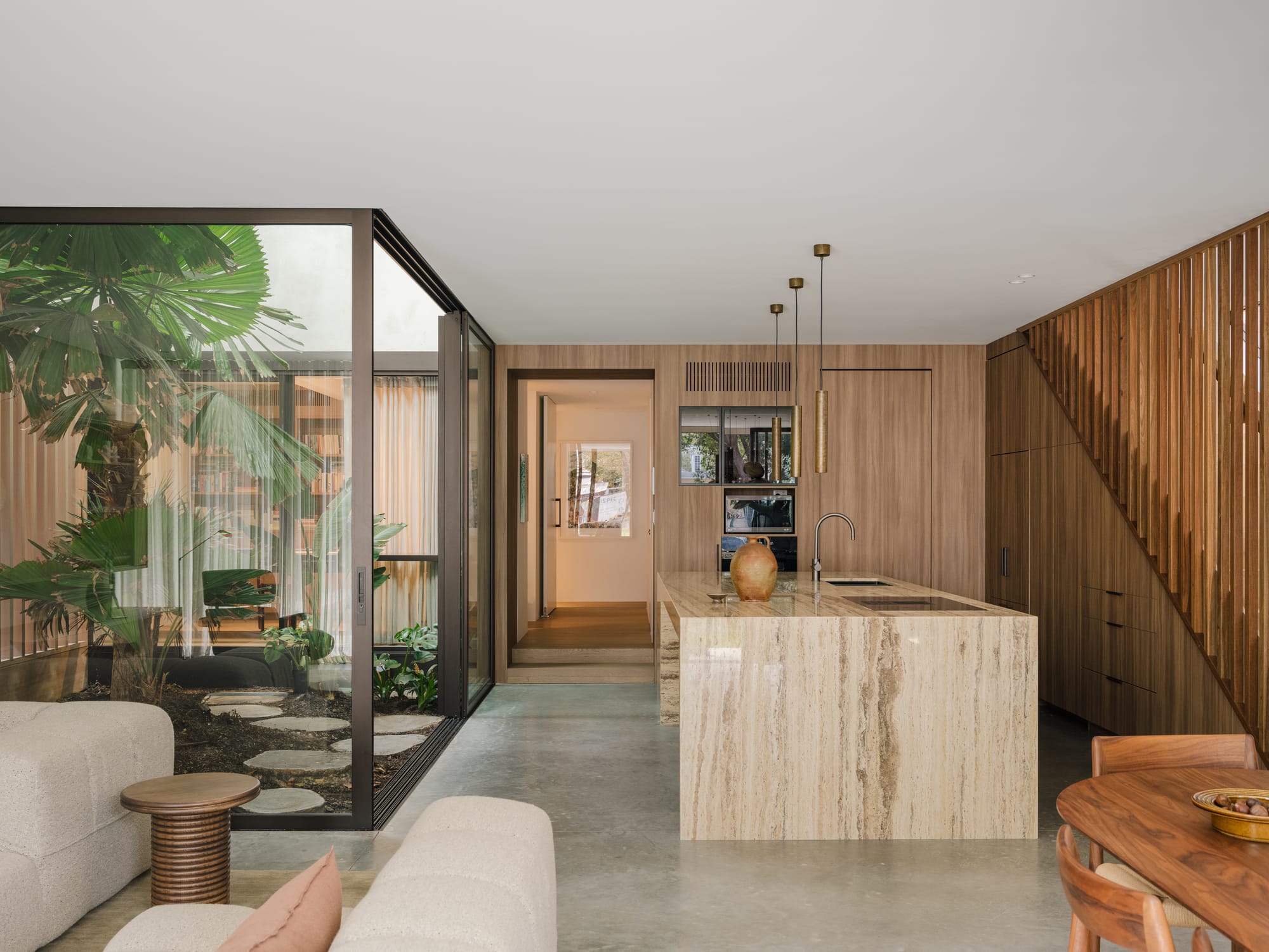 Petersham House by Cateaux Architects with CHROFI. Photography by Clinton Weaver. Double storey contemporary rear facade with tiled pool in foreground
