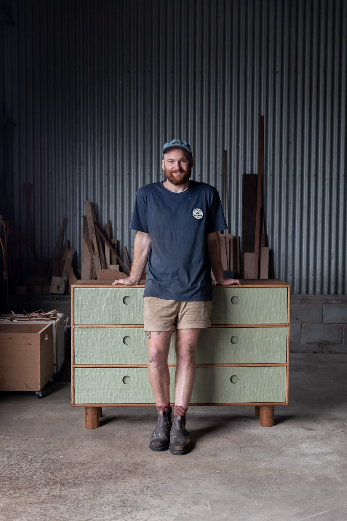A collection shot of Two Blue Boys Furniture in the warehouse including stools, sideboards and bedside tables