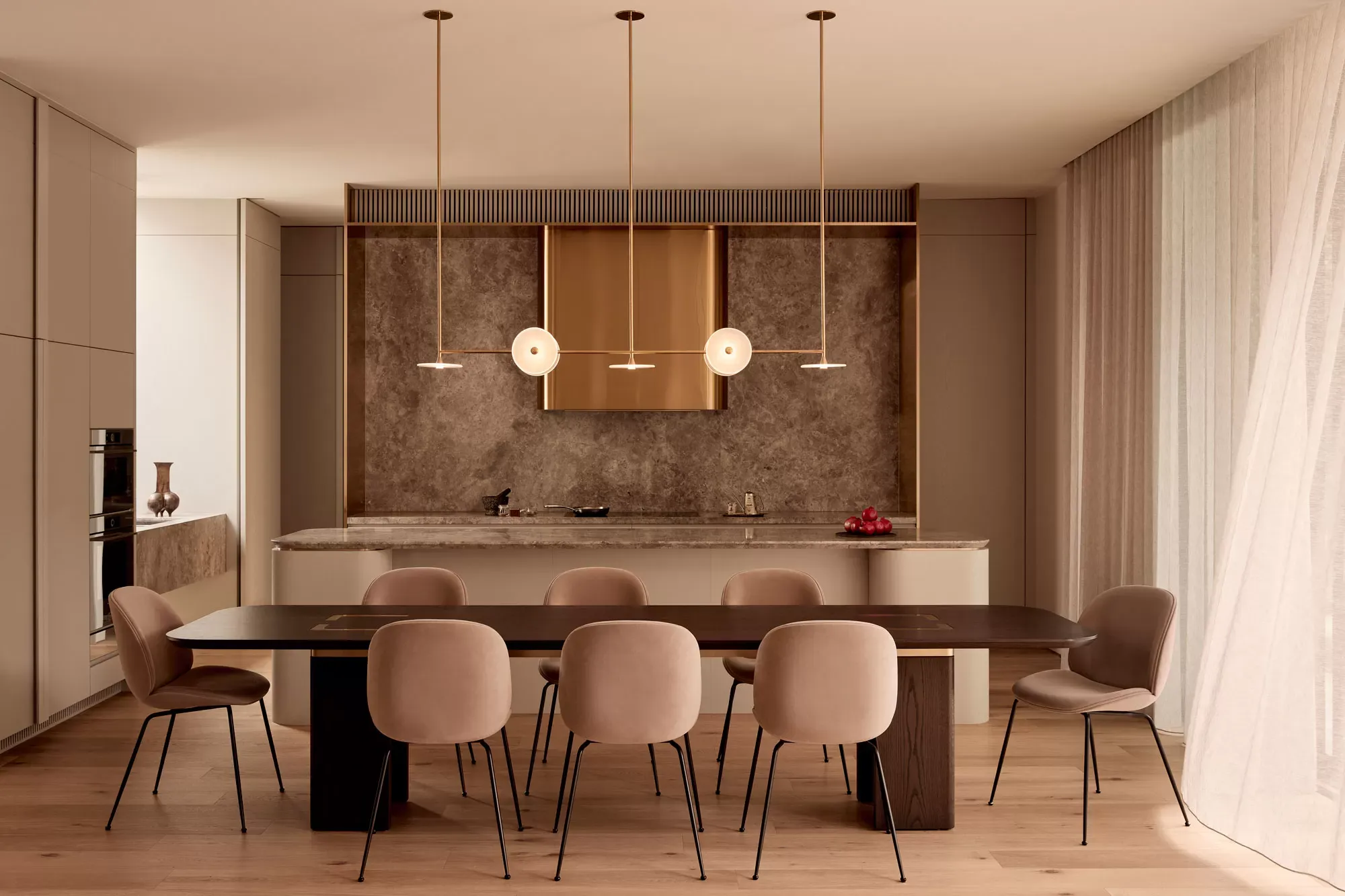 Brixton by Cera Stribley. Photography by Martina Gemmola. Dining hall with hanging minimal chandelier. Sink in the countertop behind the dining table.