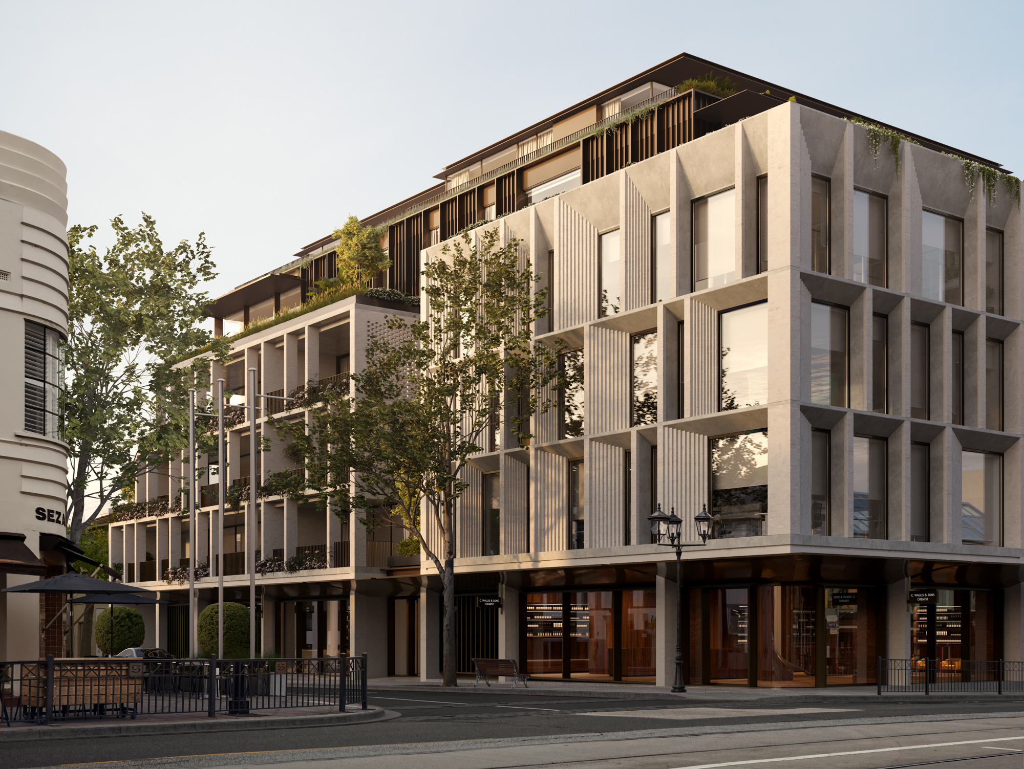 Toorak Village by KHA. Render by KHA. Facade of multi-level building on street corner with white and glass exterior.