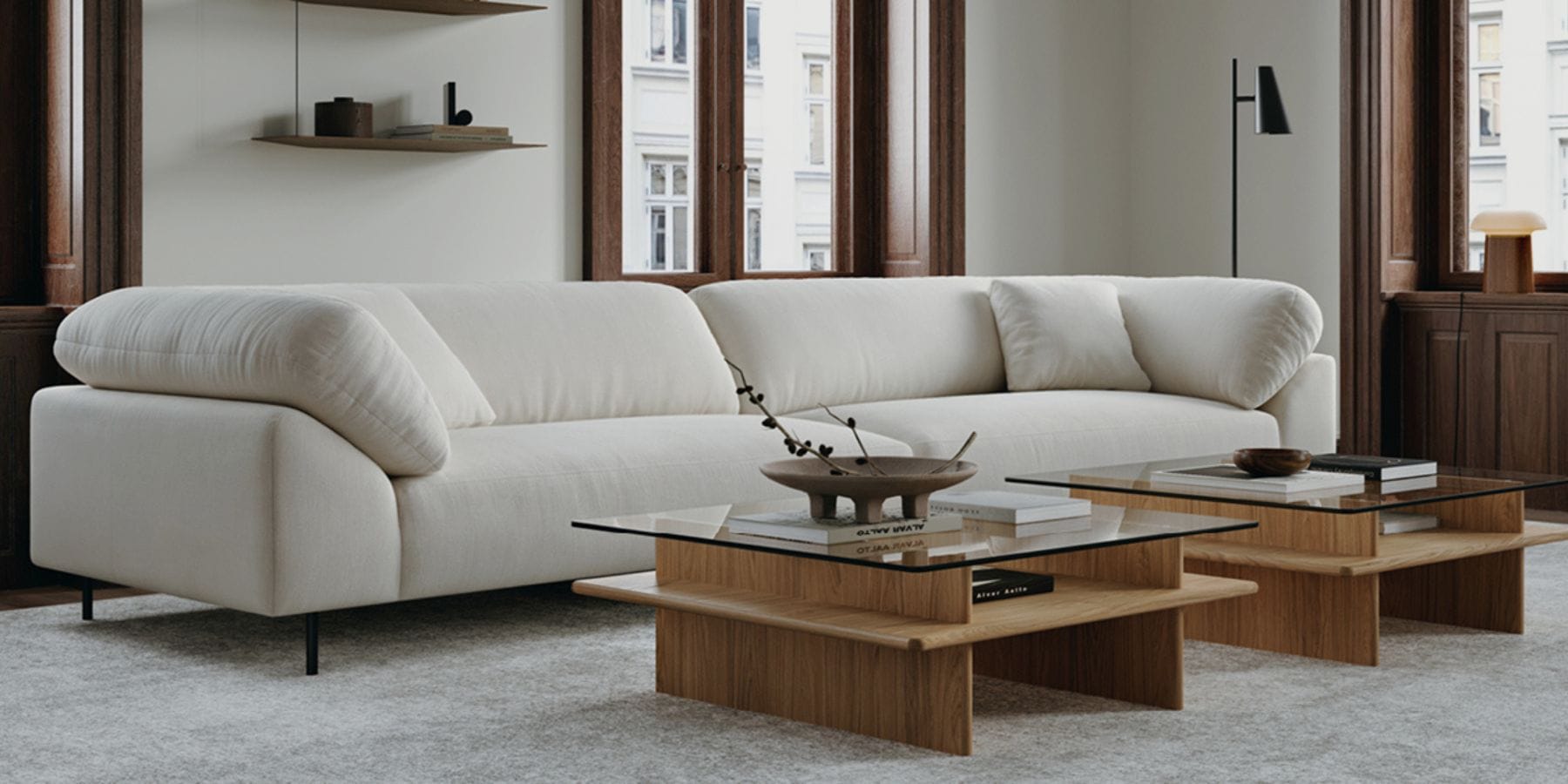 Project Kalkala by M&E Interiors showing a woman pulling a blue curtain in an office fit-out