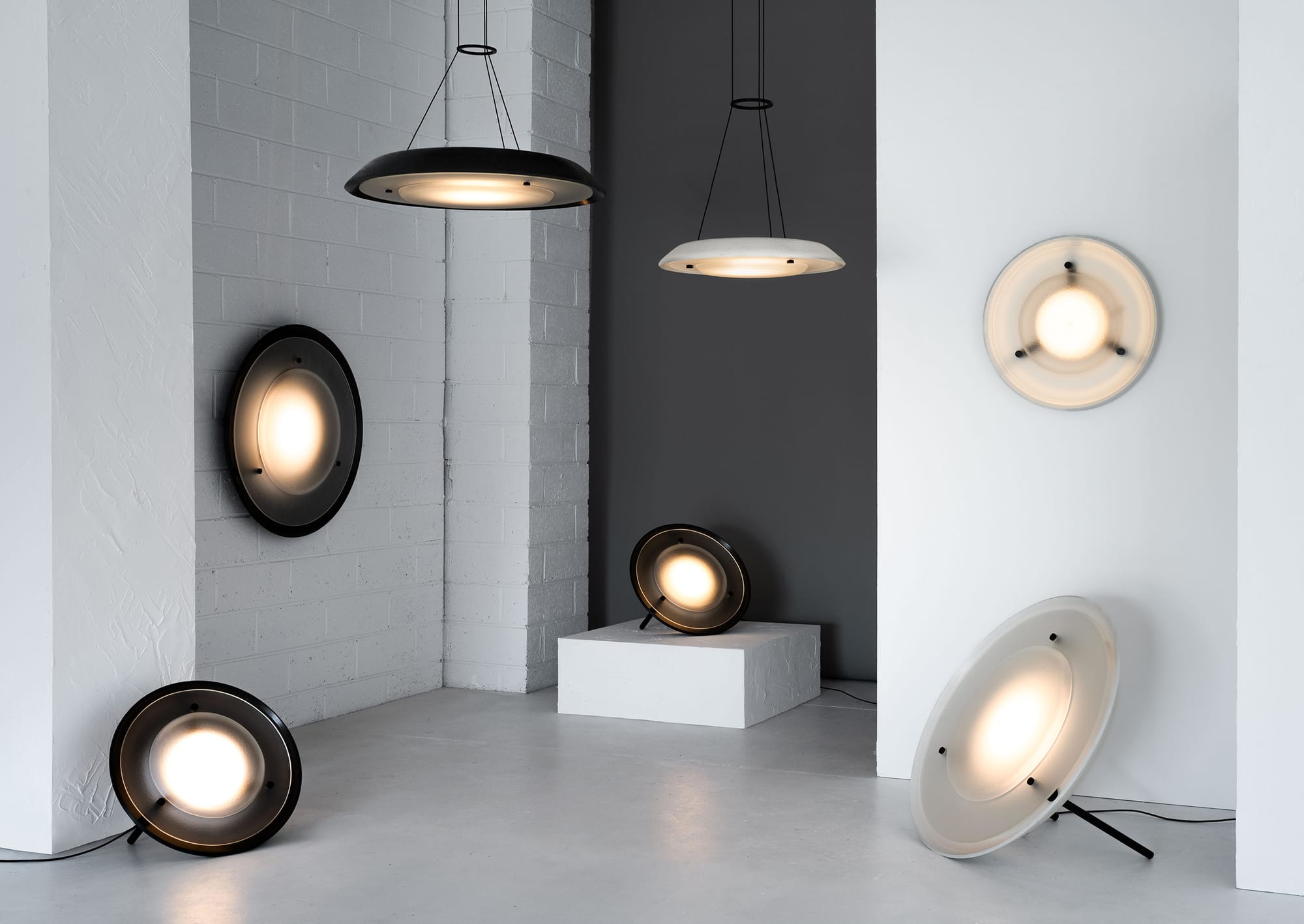 Husk Collection By South Drawn. Photography by Reannon Smith. A sculptural arrangement of Husk lights in various finishes highlights their versatility across wall, pendant, and floor applications.