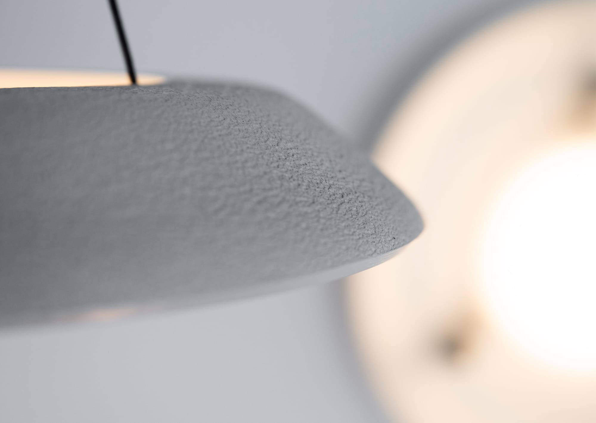 Husk Collection By South Drawn. Photography by Reannon Smith. A close-up reveals the Husk Collection’s tactile surface, showcasing the raw texture of Zeoform Micro Pulp.