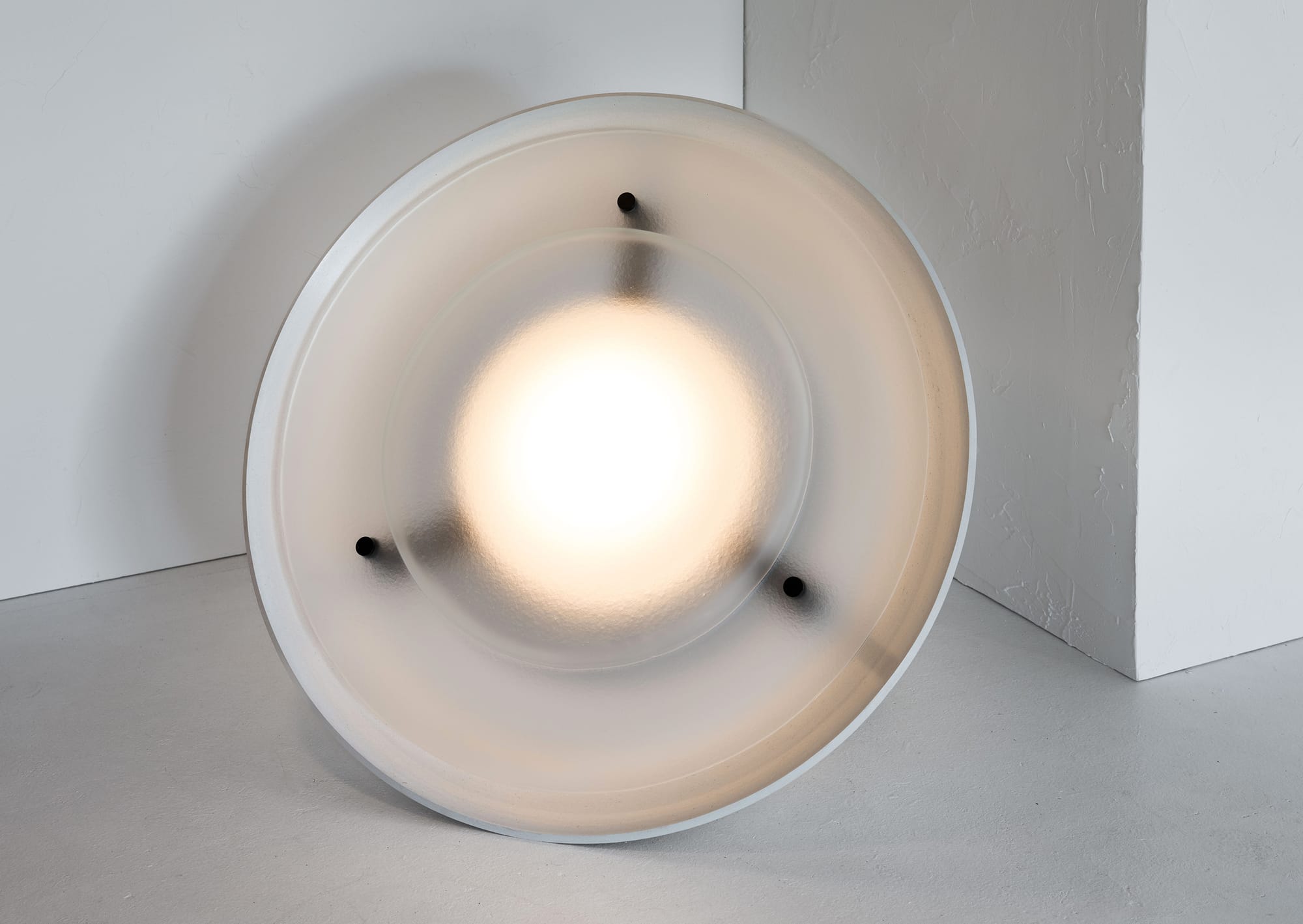 Husk Collection By South Drawn. Photography by Reannon Smith. The Husk floor lamp emits a soft, diffused glow through its curved Zeoform shell, blending sculpture and light.