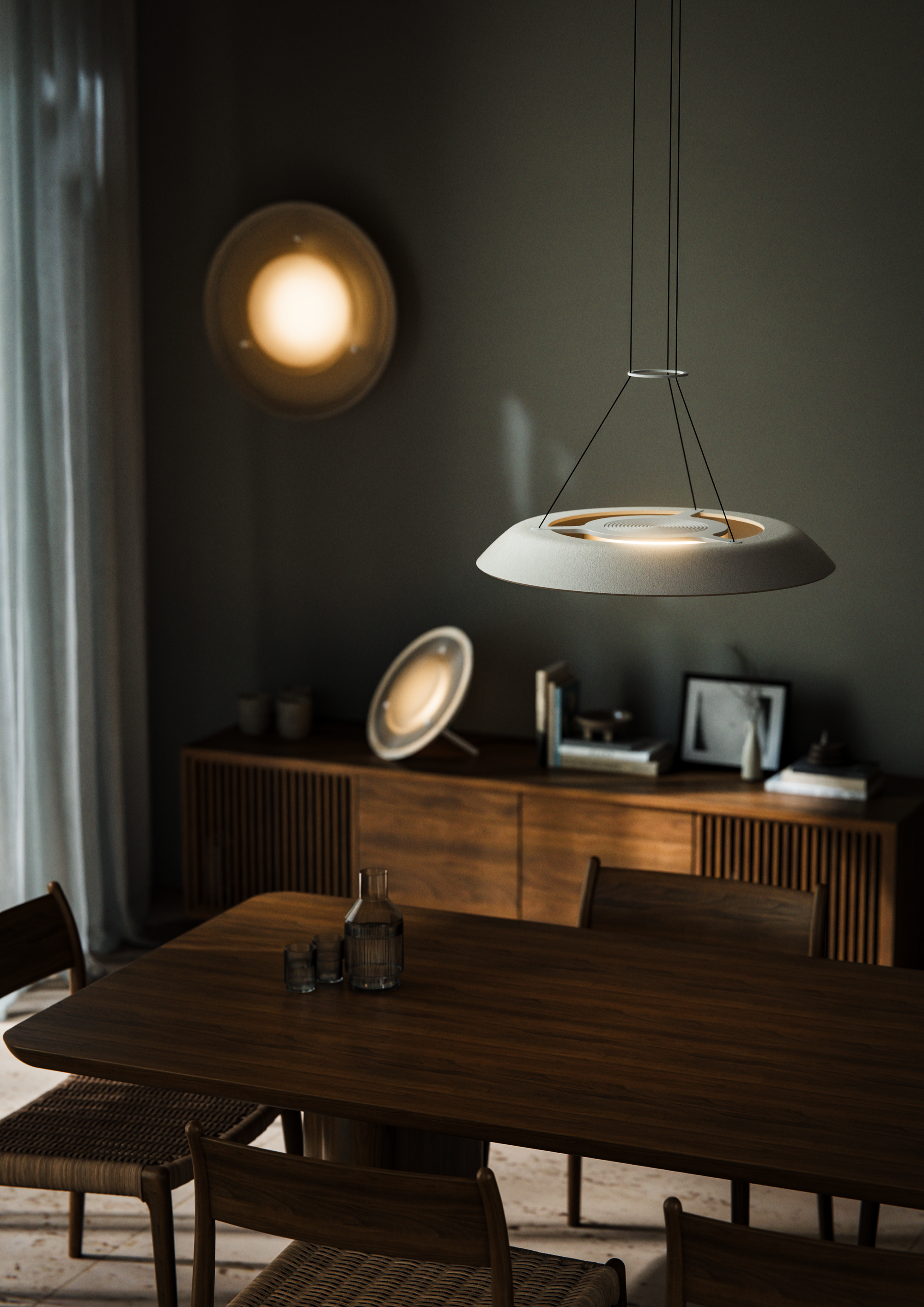 Husk Collection By South Drawn. Photography by Reannon Smith. In a warm, timber-lined dining space, three Husk lights softly glow, highlighting their sculptural presence and textured finish.