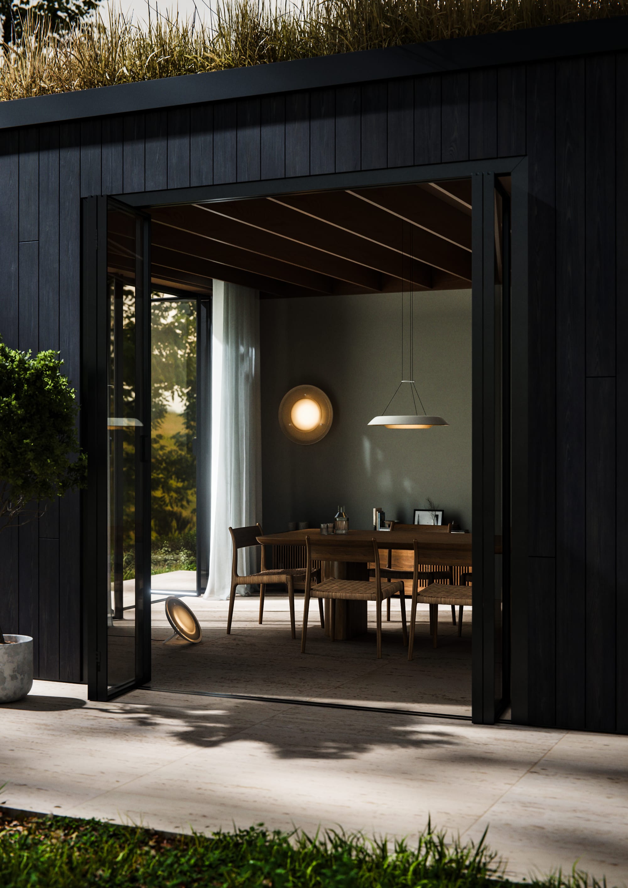Husk Collection By South Drawn. Photography by Reannon Smith. Set within a timber-clad pavilion, the Husk lighting trio adds warmth and sculptural elegance to the indoor-outdoor dining space.