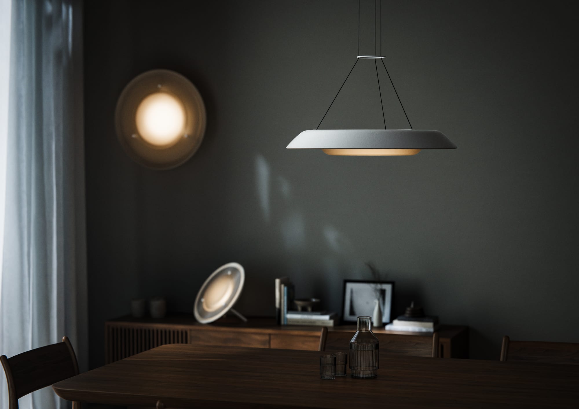 Husk Collection By South Drawn. Photography by Reannon Smith. A close-up of the Husk pendant reveals its soft, ambient glow floating above warm timber tones.