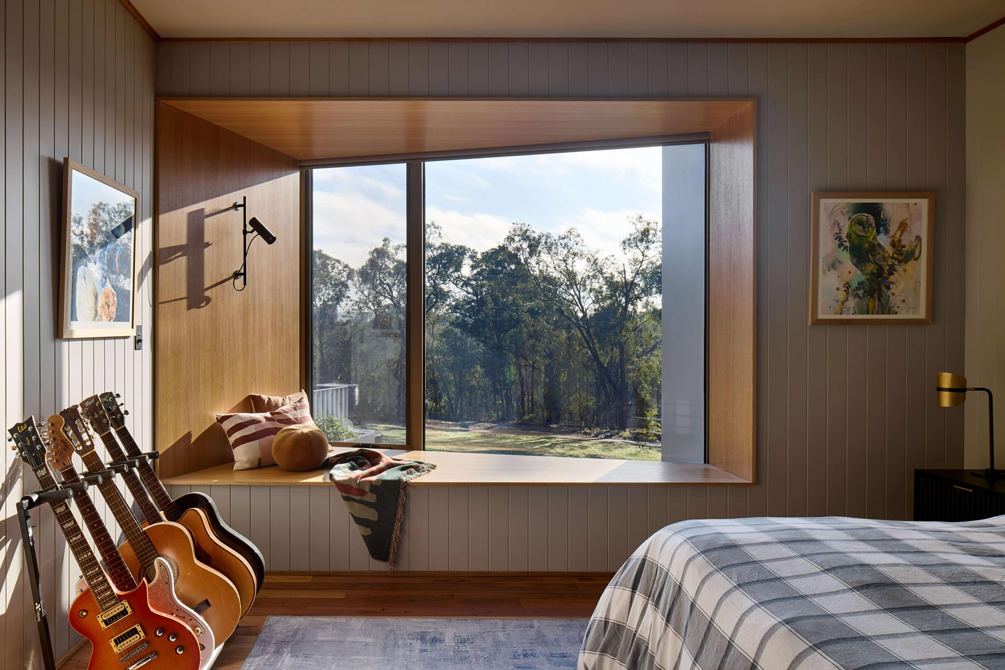 Korinda House by BENT Architecture. Photography by Tatjana Plitt. Bedroom with integrated window seat, and guitars leaning against left wall. 