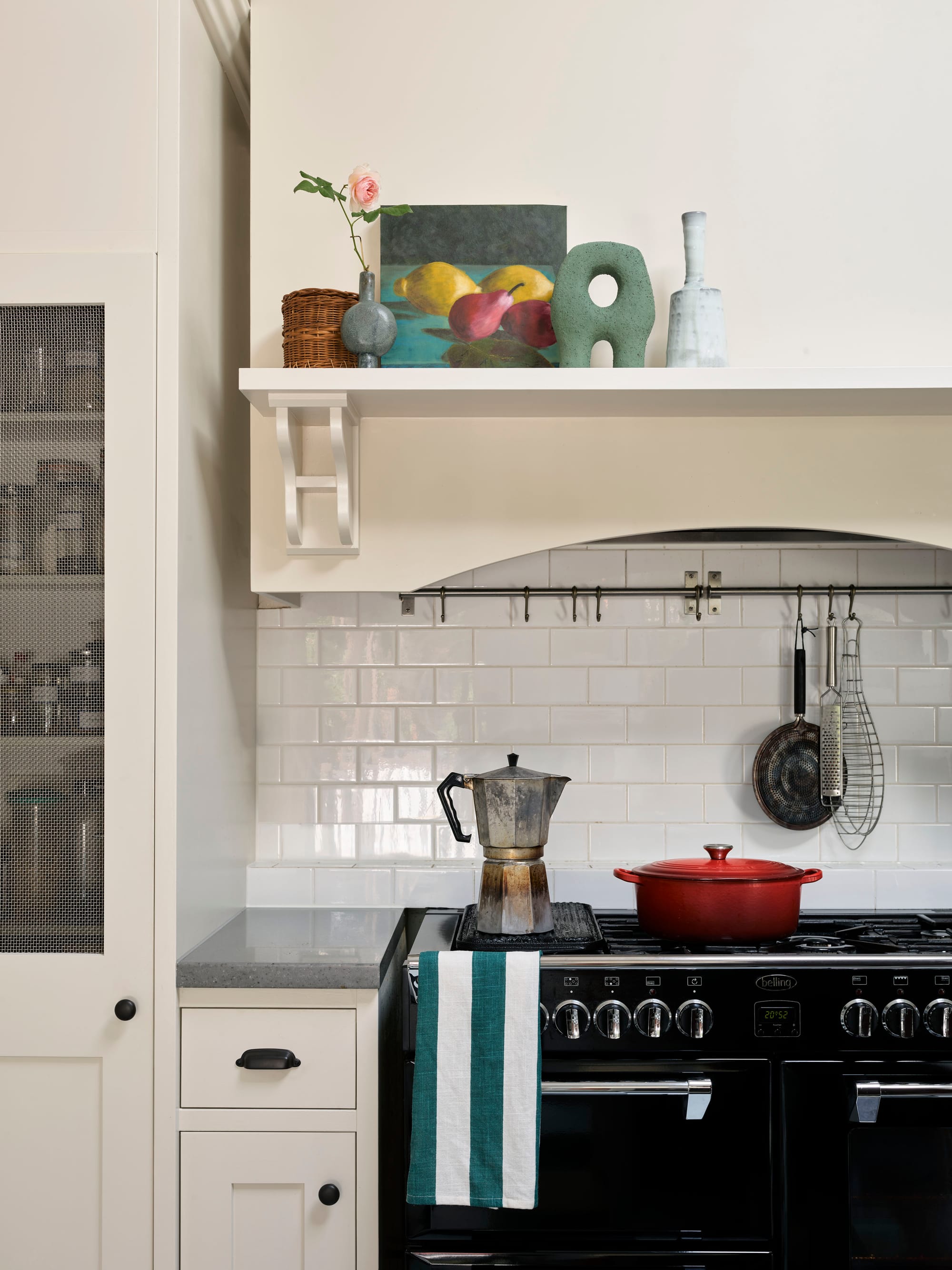 Ferris Street by Marylou Sobel Interior Design. Photography by Anson Smart. Kitchen with black oven, white subway tiles, and heritage inspired cabinetry. 