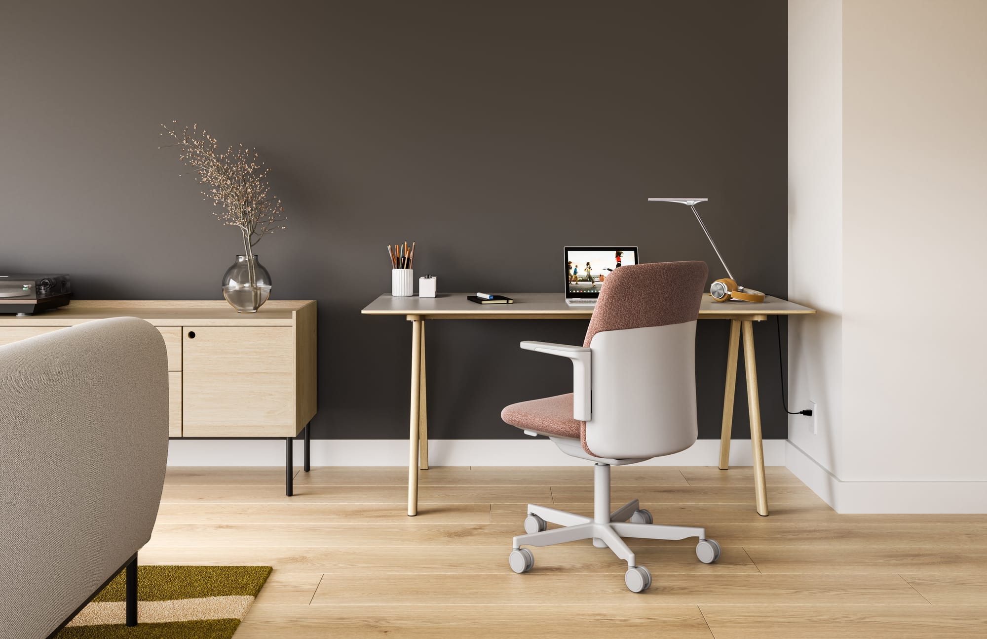 Humanscale, Brand Partner for M&E Interiors. Home office space with white and salmon chair, white and timber desk and dark grey wall paint. 