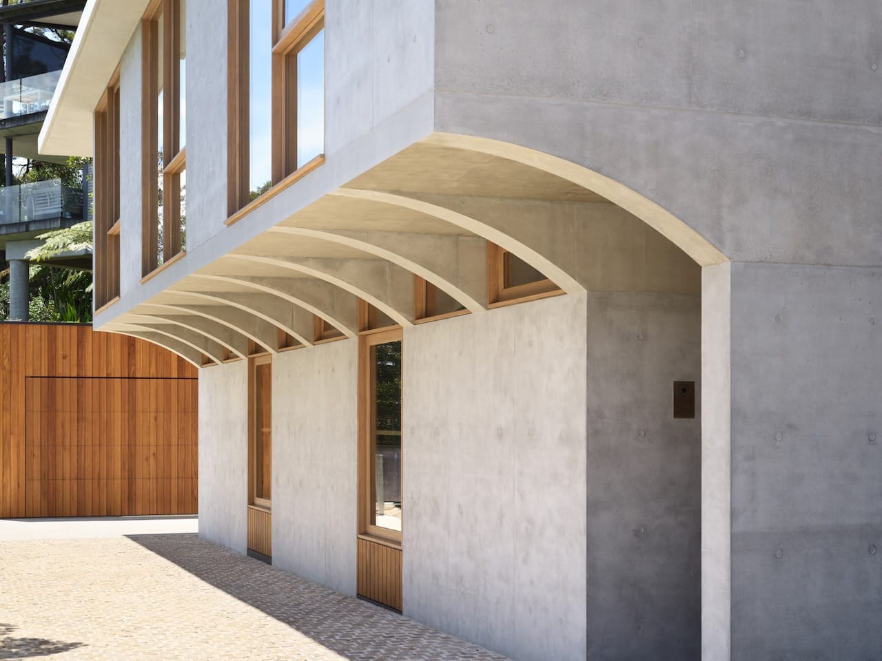 Corbel House by Nick Bell Architects. Photography by Justin Alexander.  Double story concrete and glass house. 