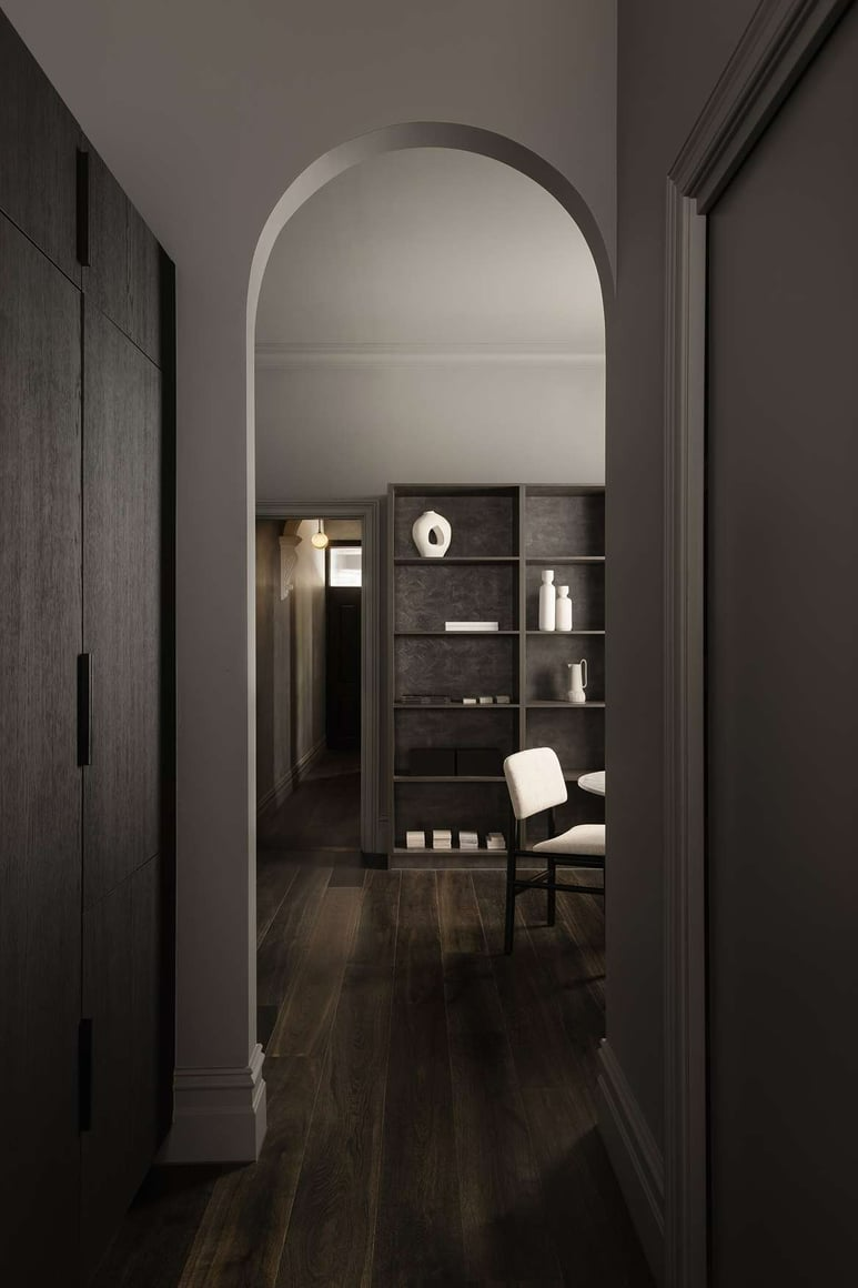 House of Terrain 9 by Terrain Nine Design Studio. Photography by Timothy Kaye. Hallway with archway, dark timber flooring, and integrated timber storage. 