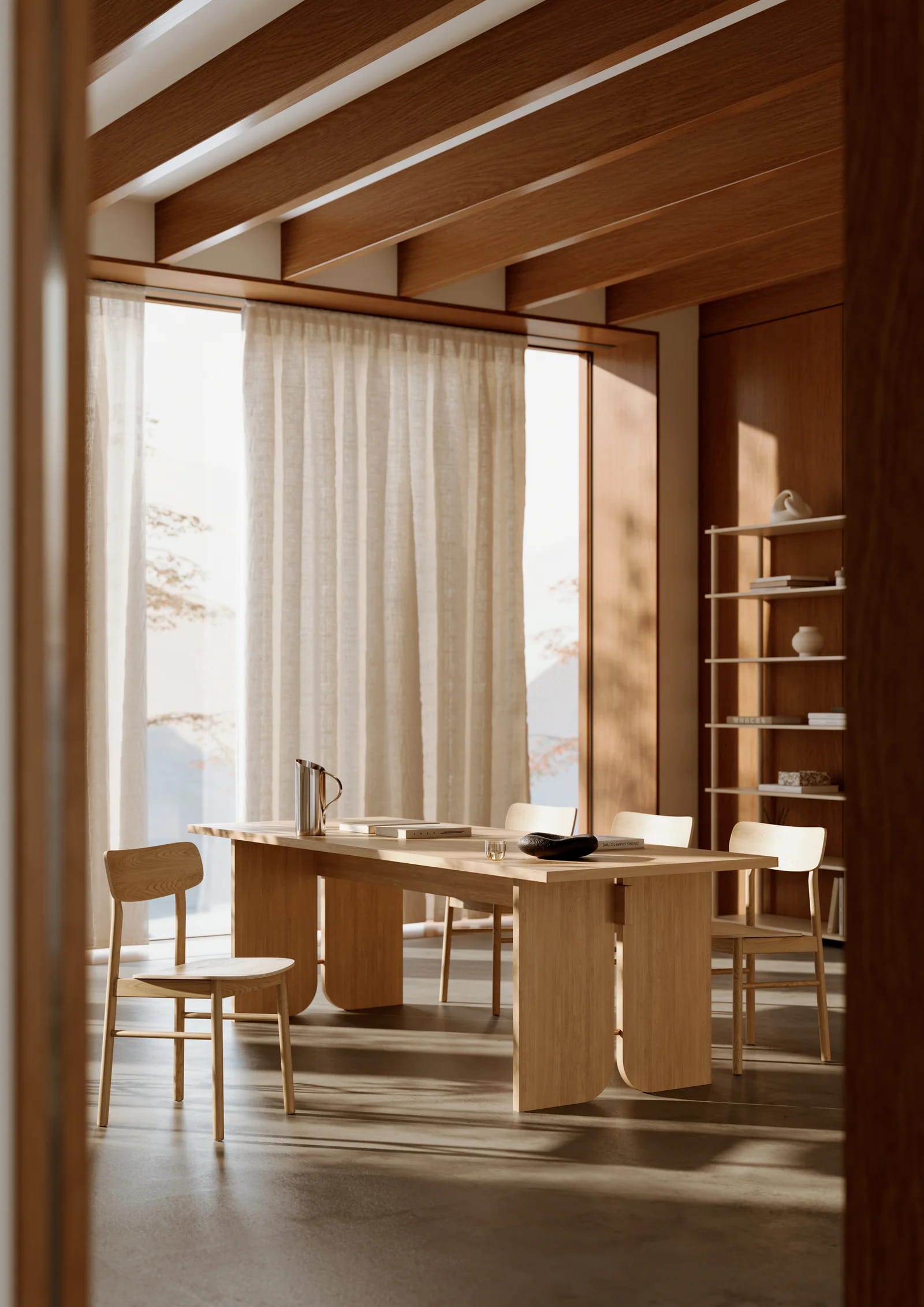 Billiani, Brand Partner for M&E Interiors. Maroon dining chair with scalloped back support detail at white and orange round dining table. 