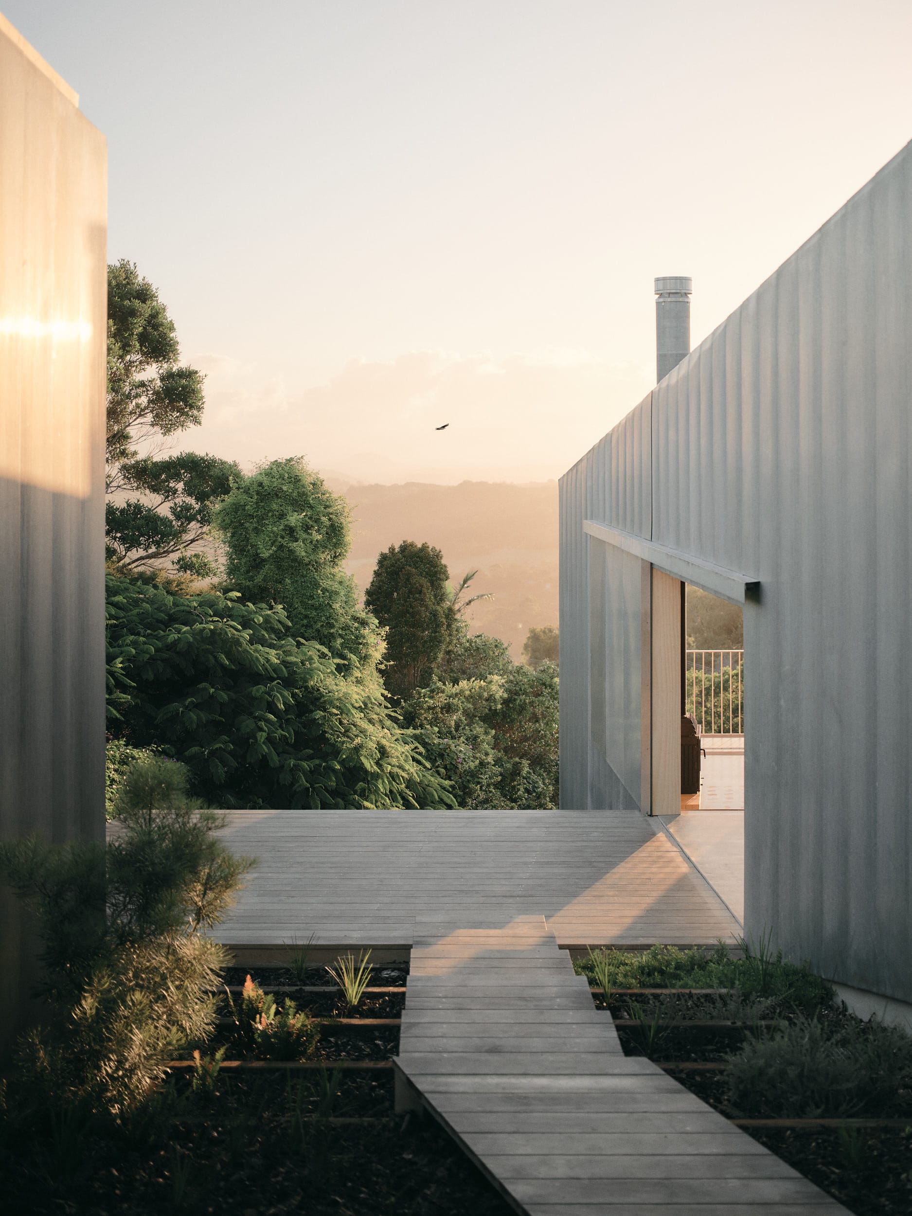 Mapleton House by Atelier Chen Hung. Photography by David Chatfield. Timber stairs leading to timber deck overlooking mountains.