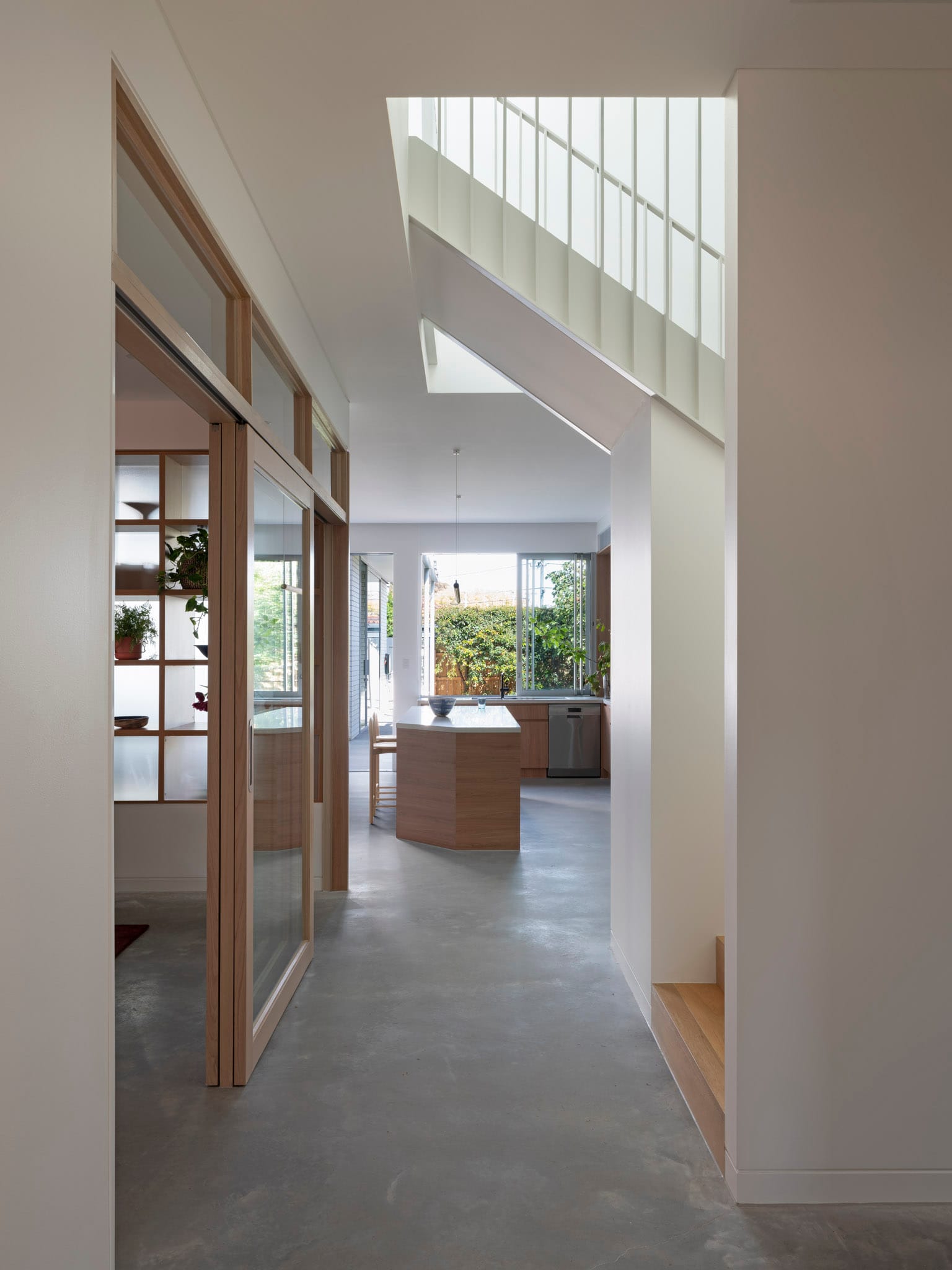 Merrilands by BIJL Architecture. Photography by Tom Ferguson. Bedroom with plum curtains, white walls, timber footstall at end of bed and graphite-coloured bedhead.