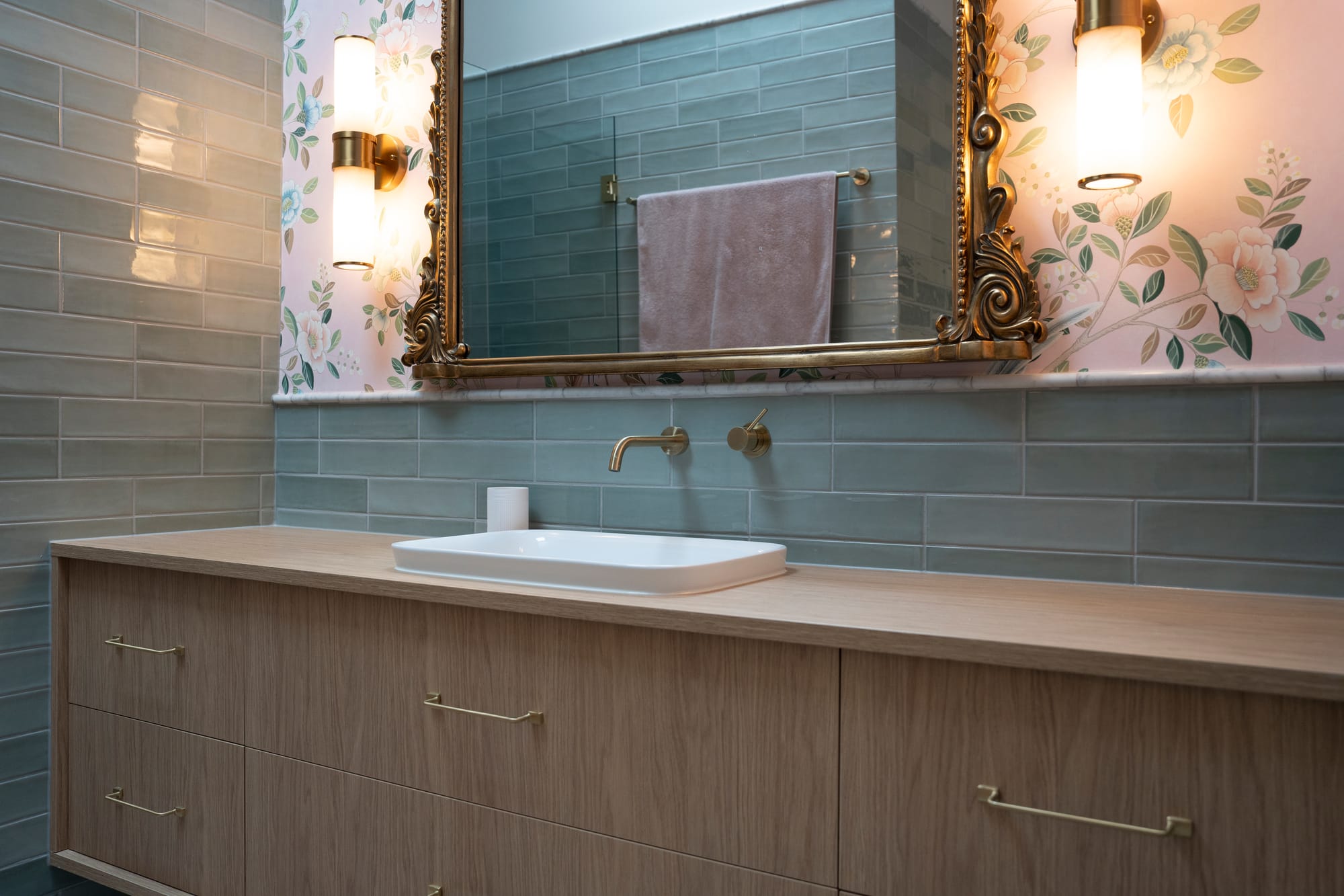 Port Melbourne 2.0 by PREM.BUILT. Image copyright of Prem.Built. Bathroom with light teal subway tiles, pink floral wallpaper and timber cabinetry. 