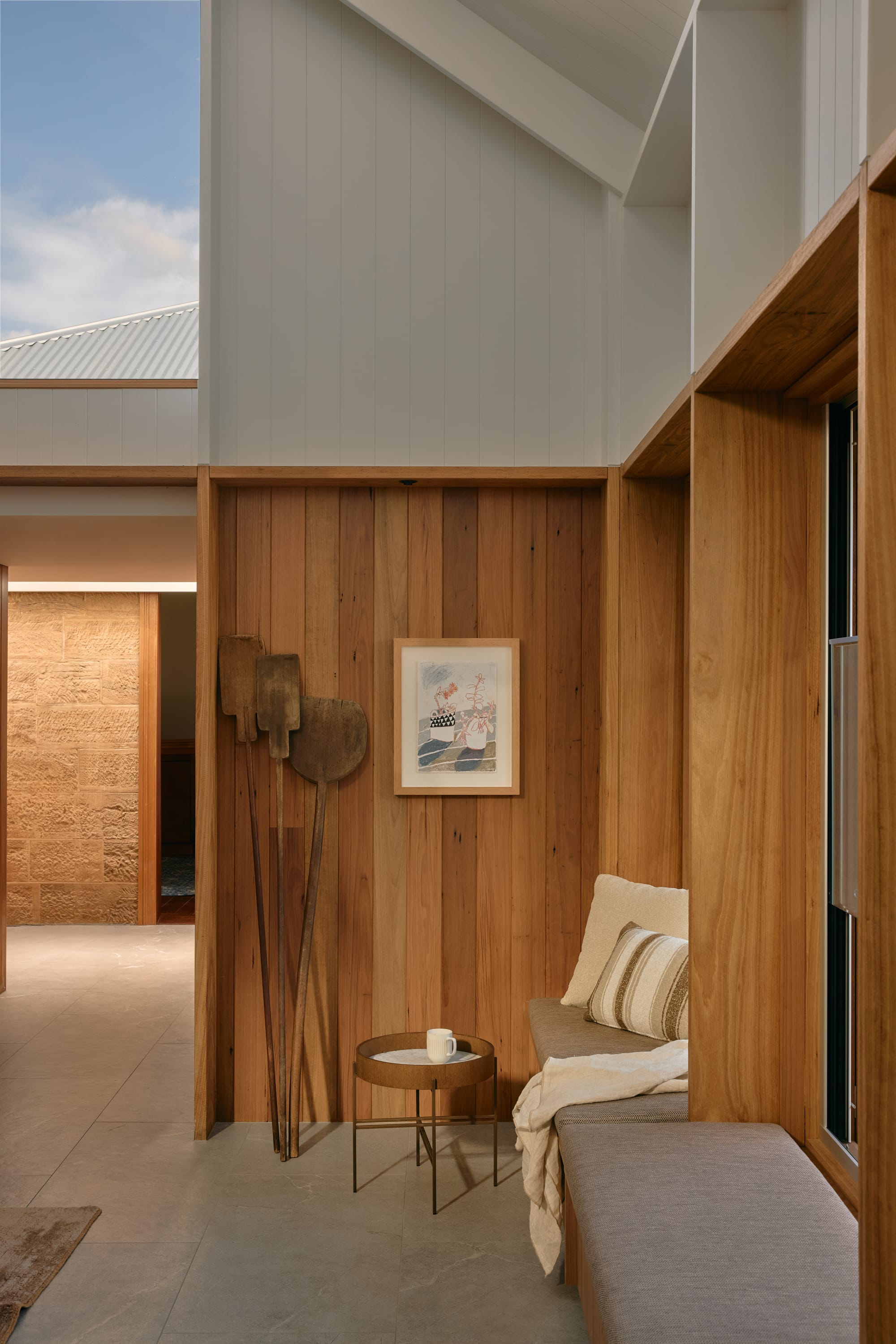 Binnum Homestead by Alexandra Buchanan Architecture. Photography by Cieran Murphy. Entry foyer with high, exposed white ceilings with large skylight and timber clad walls. 