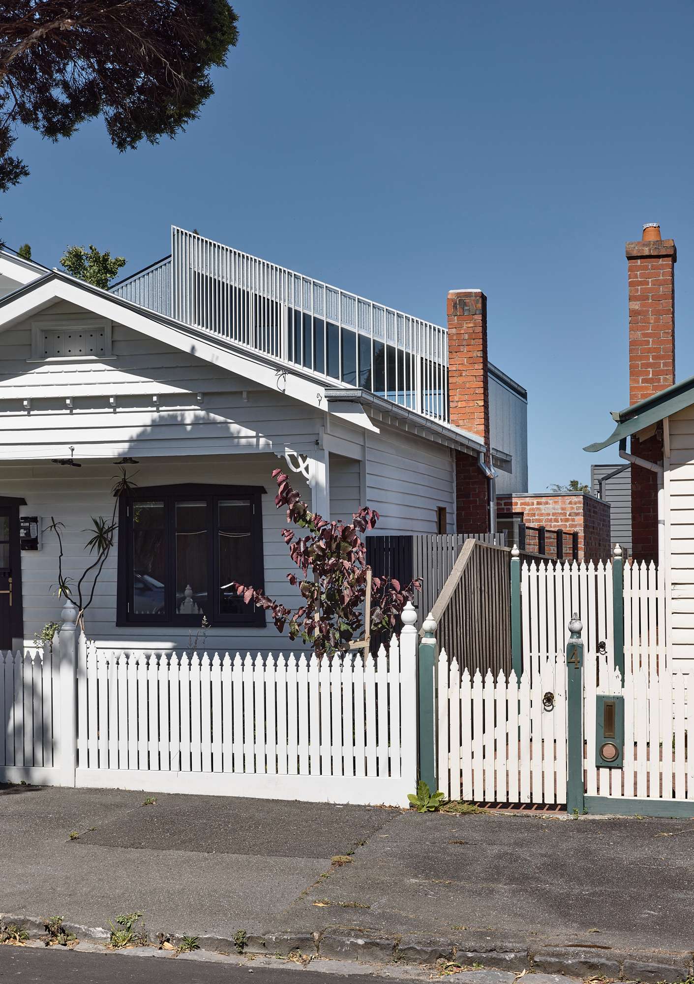 Brooke by Ola Architecture Studio. The exterior of a renovated cottage showing the street view.
