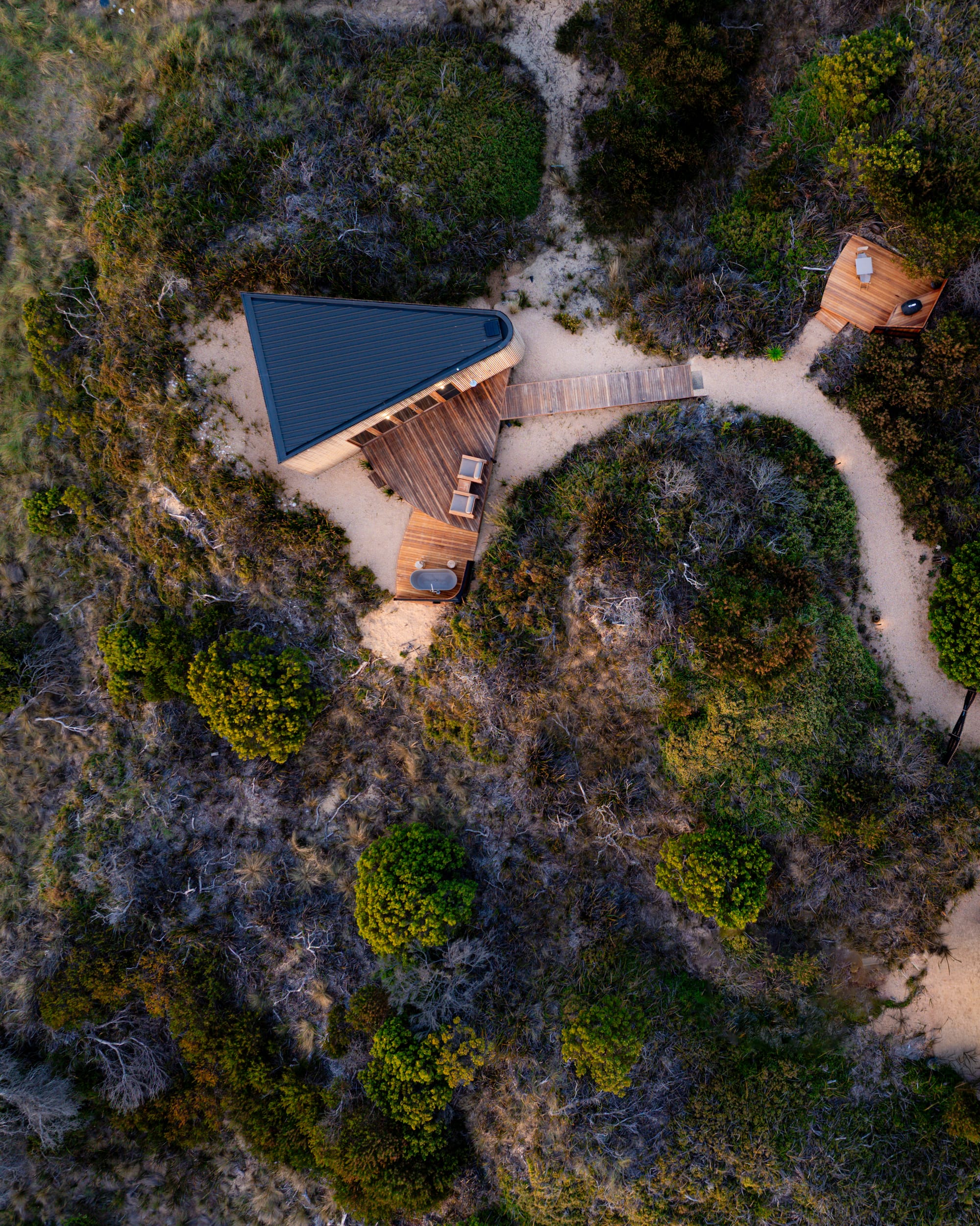 A birds eye view of Studio Tasmania showing the cabin sitting in the landscape.