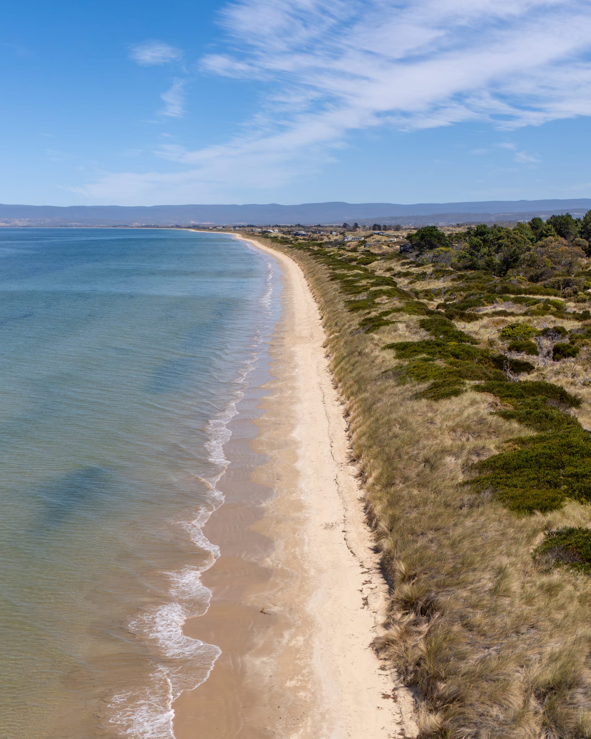 A location shot of Studio Tasmania showing the rugged Tasmanian beach that it sits on.