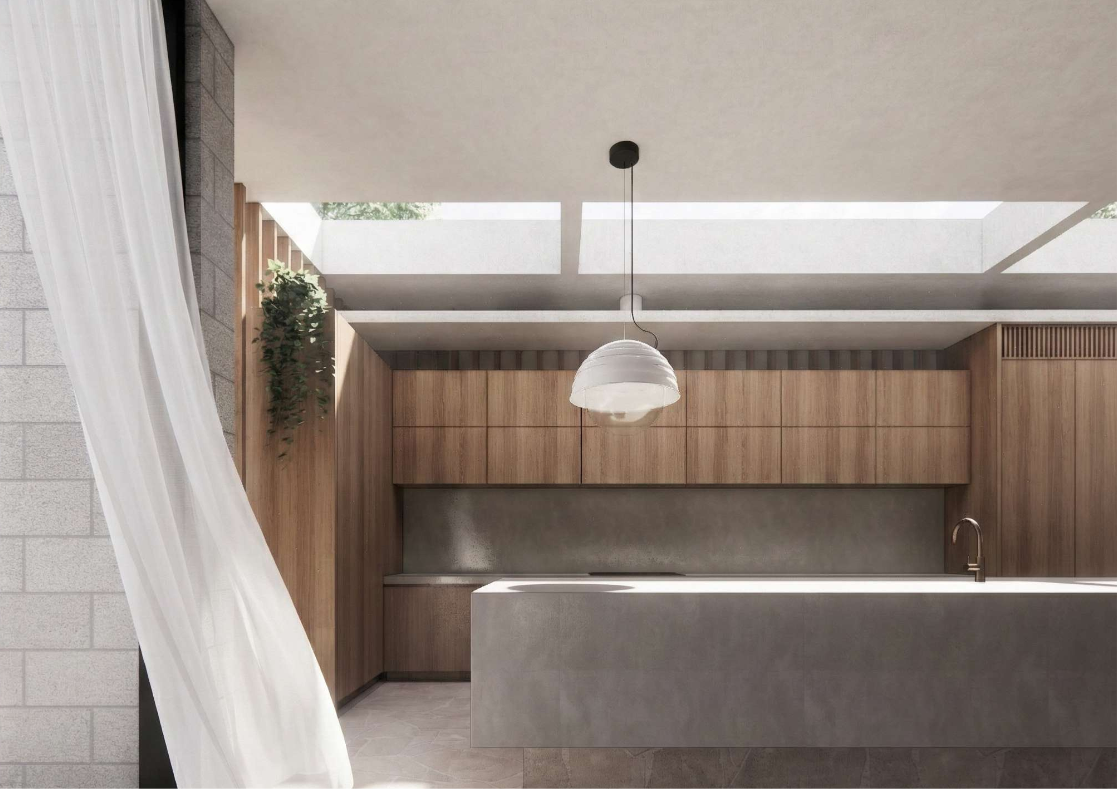 Contemporary concrete and timber kitchen with monolithic island, skylights, and restrained material palette.