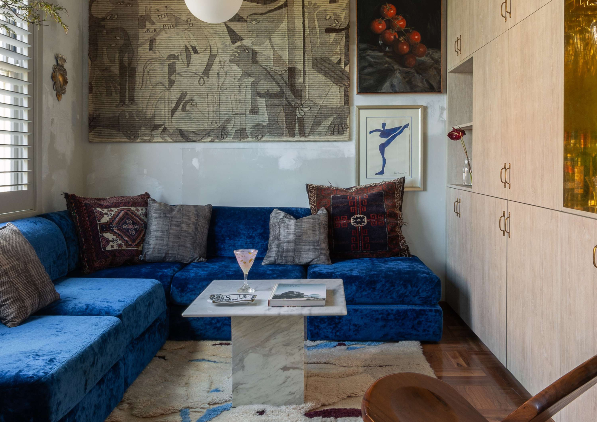 Living area with timber-framed doors opening to outdoor deck, showcasing indoor outdoor connection