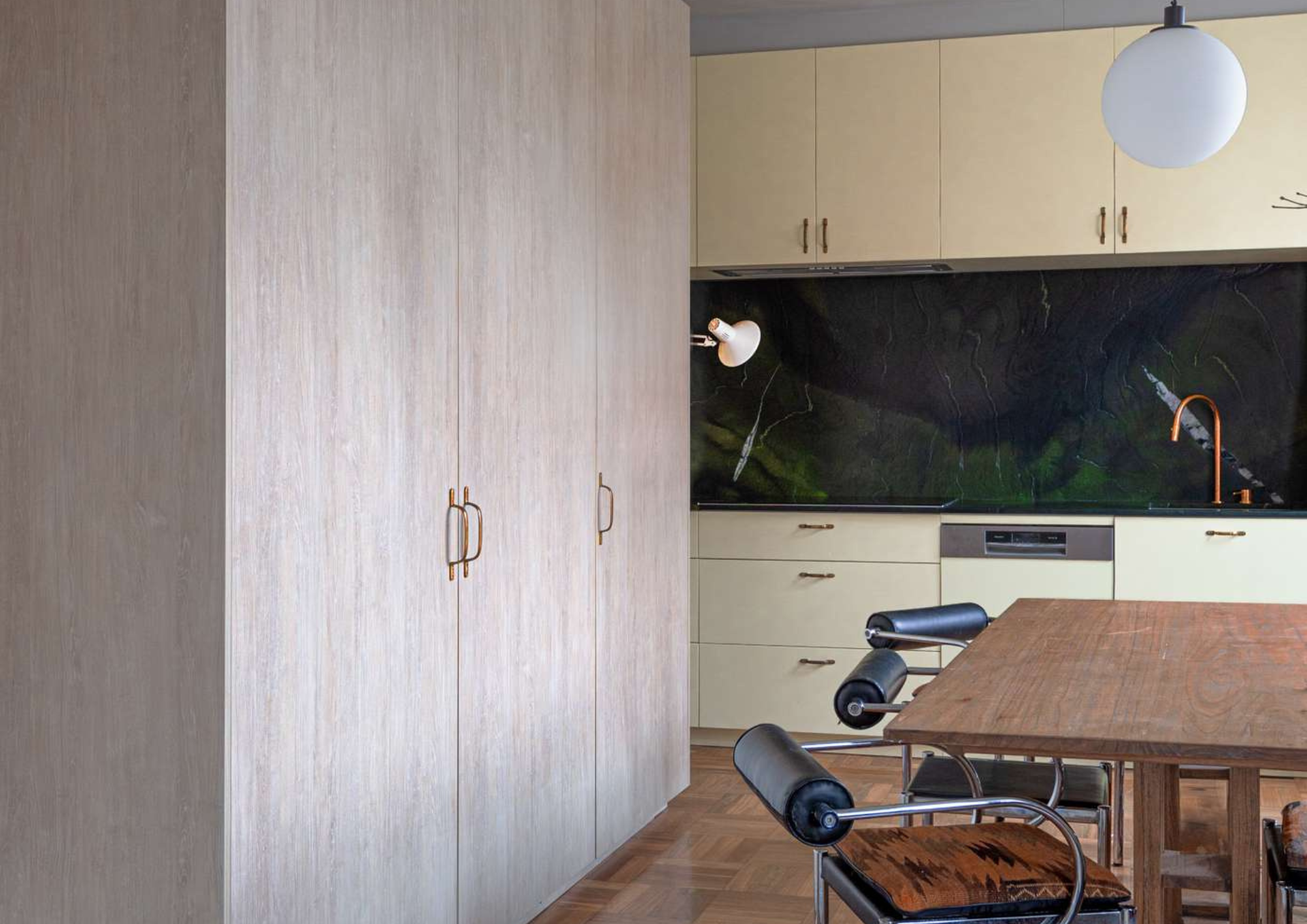 Living area with timber-framed doors opening to outdoor deck, showcasing indoor outdoor connection