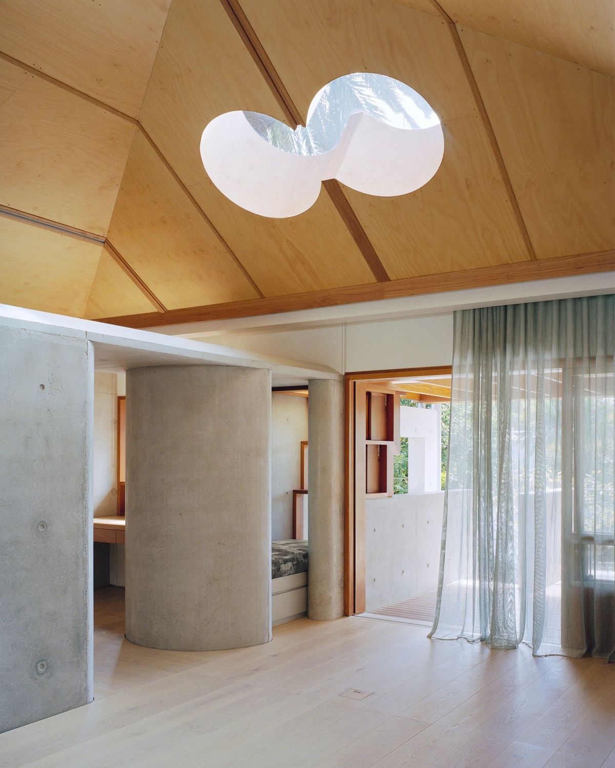 Lee House by Candalepas Associates showing concrete and timber interior