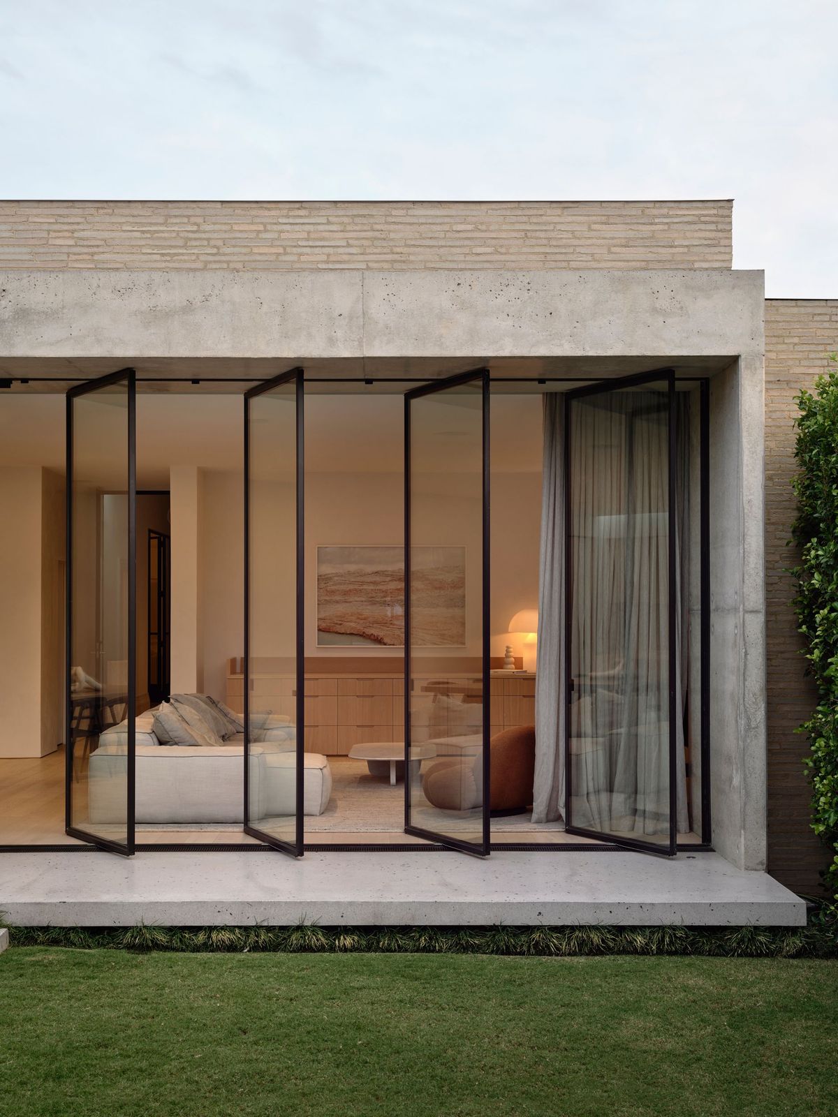 Rear extension of the RE Residence by Inglis Architects opening out to courtyard