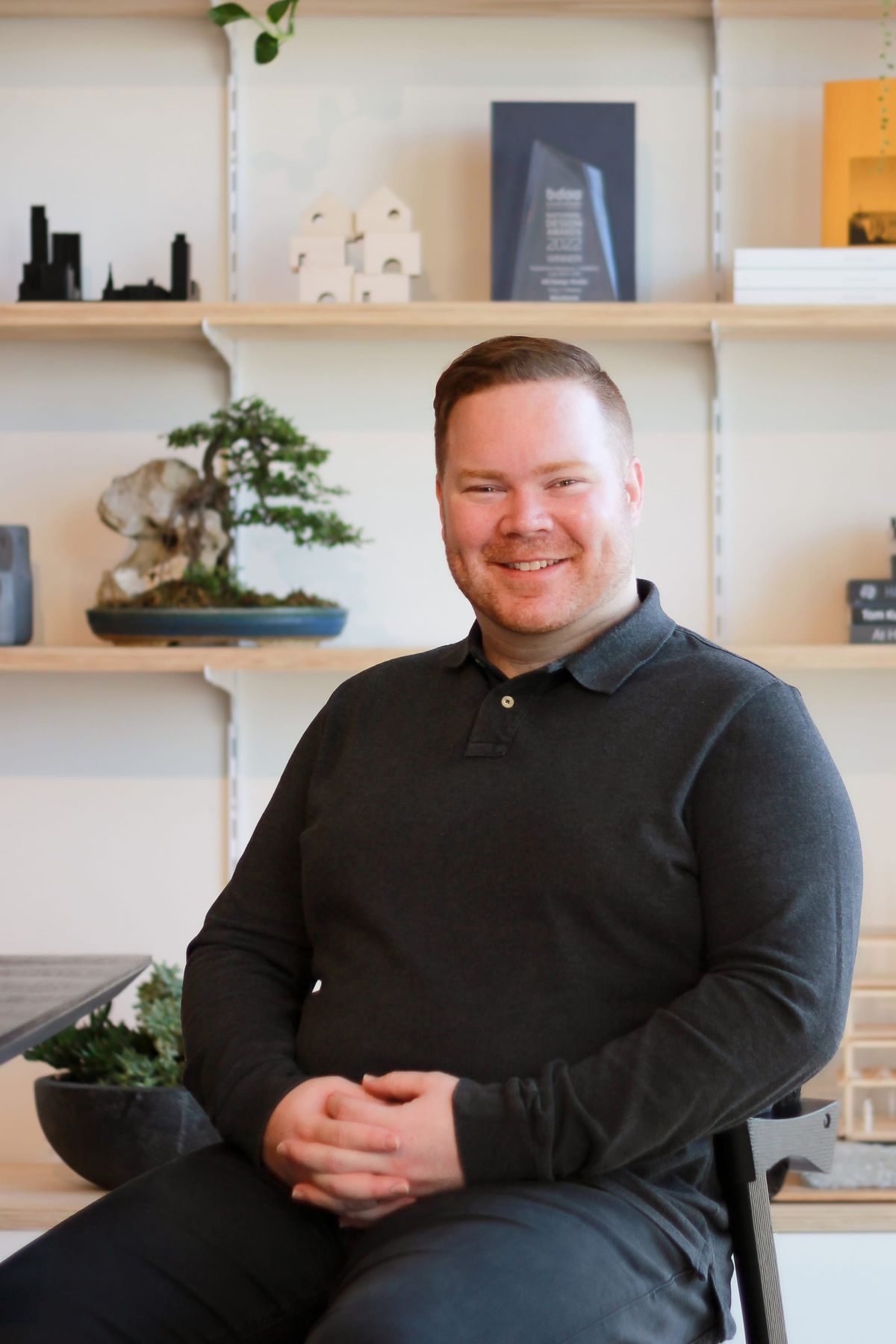 Tony O'Meara of AO Design Studio.  Headshot of smiling man with short red hair in black shirt. 