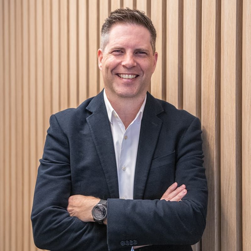 John Stubbs of 77 Architecture. Copyright of 77 Architecture. Headshot of smiling man in suit.