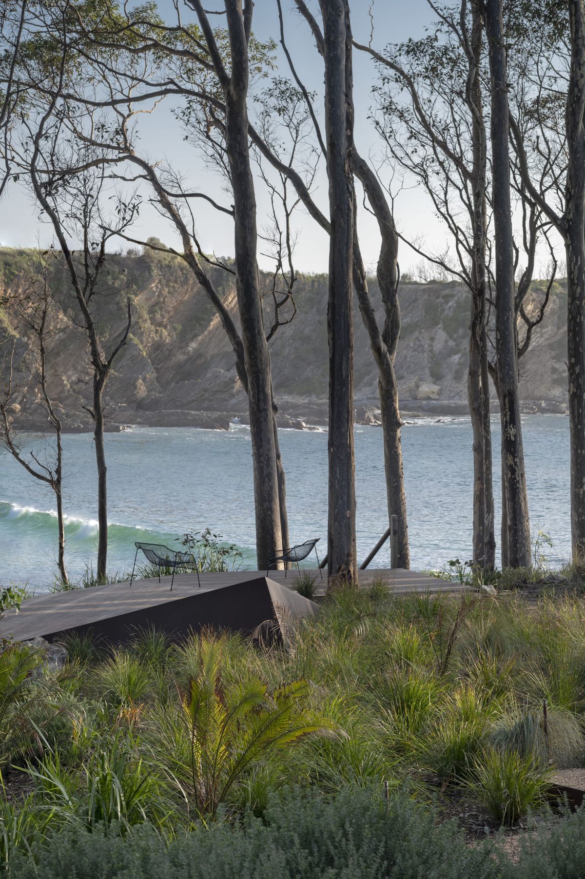 Bracken by Secret Gardens. Photography by Nicholas Watt. Timber deck overlooking coastline. Native Australian plant