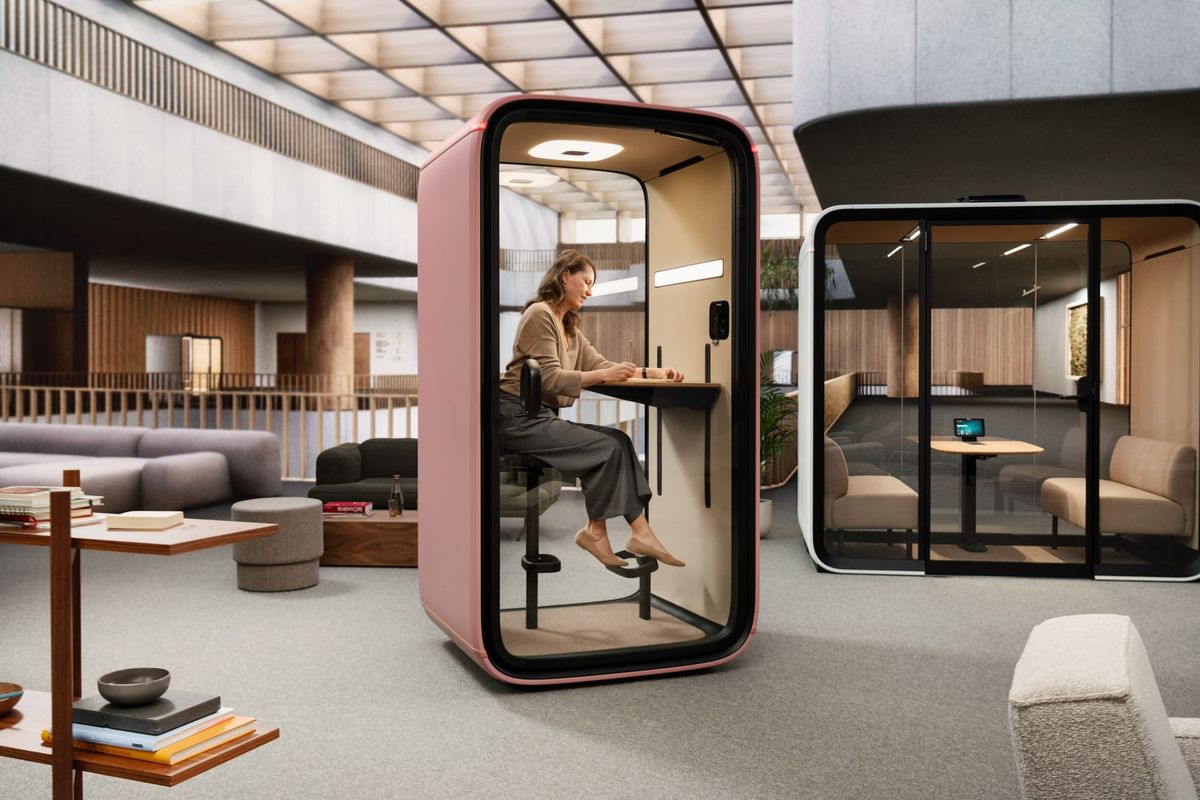 Framery Smart Pod. Copyright of Framery. Woman sitting in pink work pod.