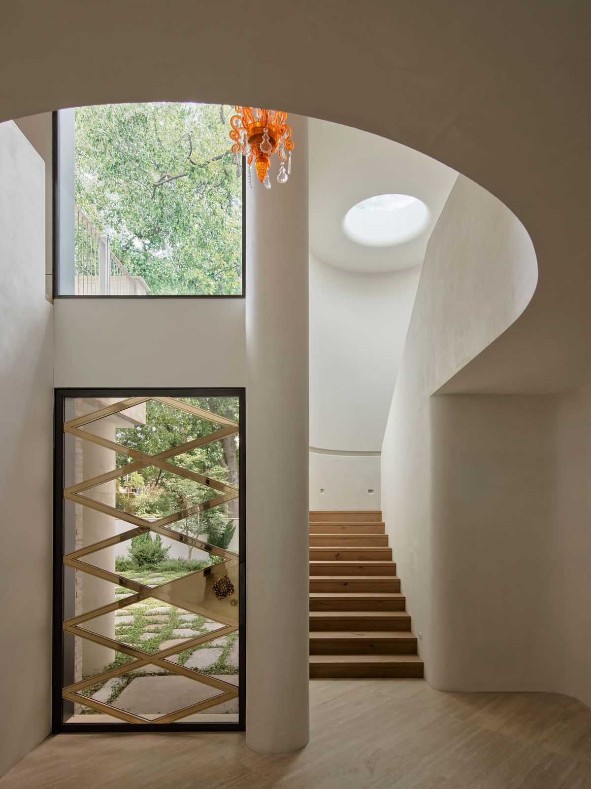 Toorak House 2 by K.P.D.O. Photography by Sharyn Cairns. Black and gold abstract front door. 