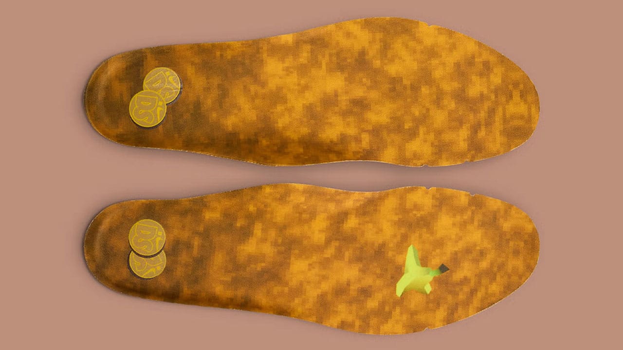 Insoles for the Big Head Origins shoes from Nike with Donkey Kong Country-esque coins and a banana. 