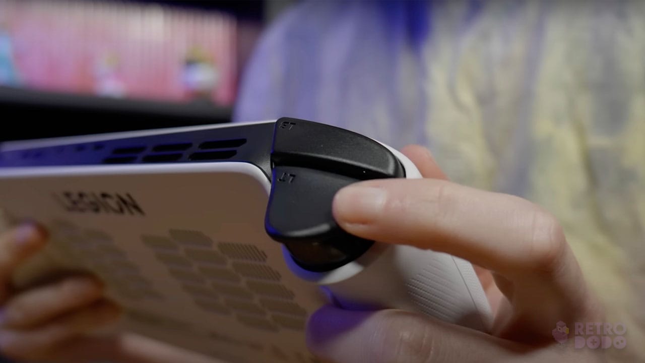 Rob pressing a back trigger on the Legion Go S