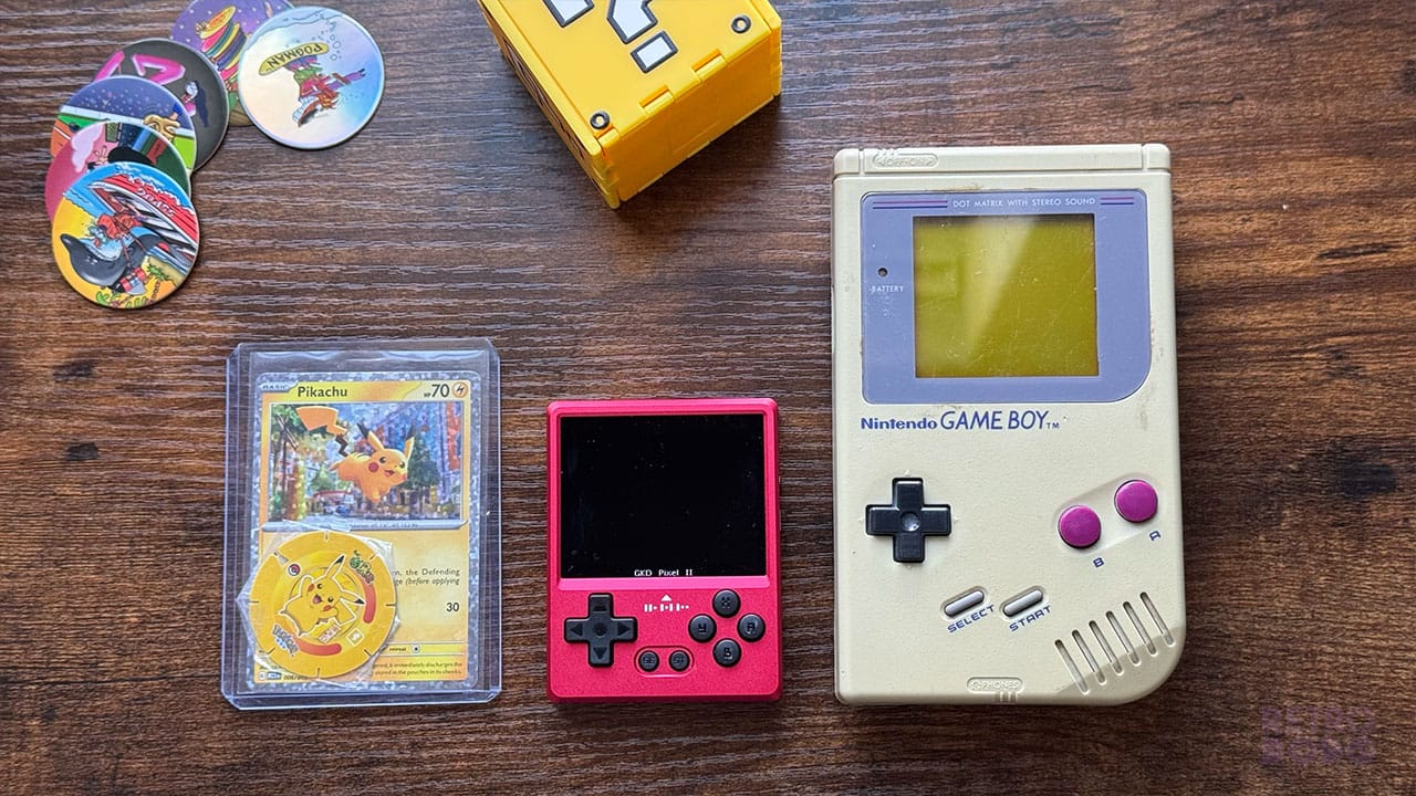 The GKD Pixel 2 next to a Pokémon card and a Game Boy DMG (Grey) to show how small it is