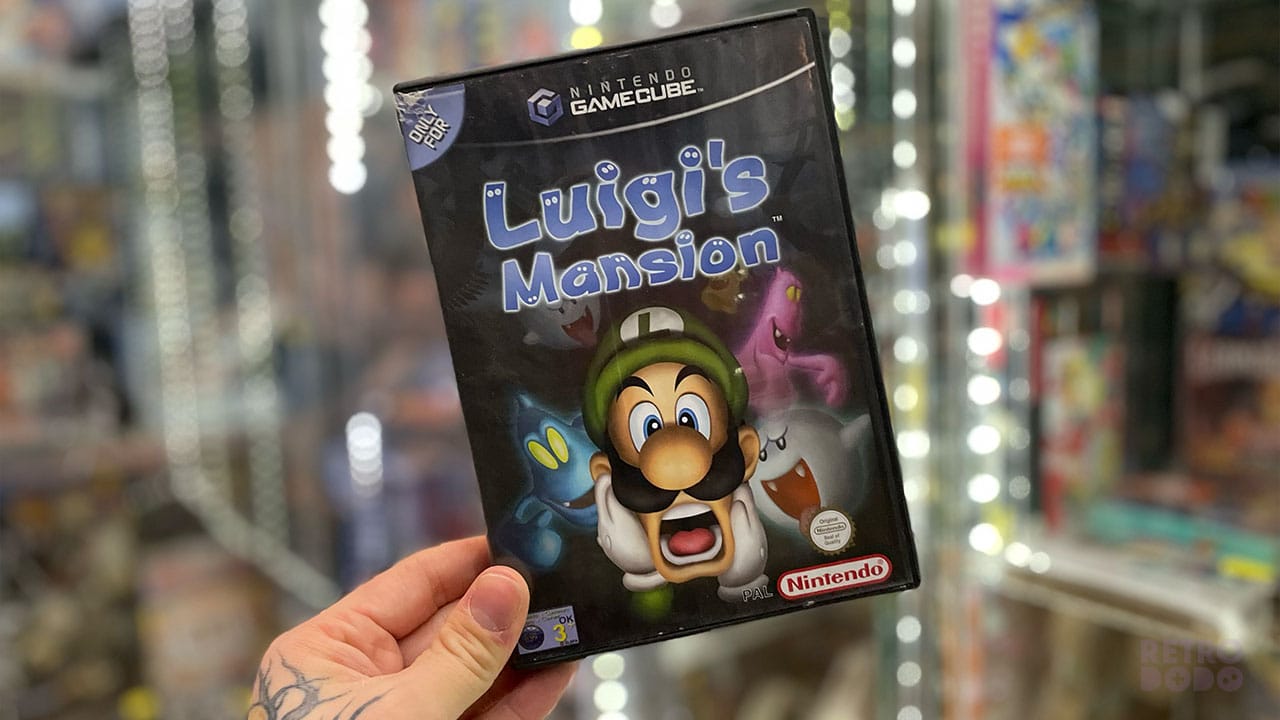 Seb holding Luigi's Mansion game case