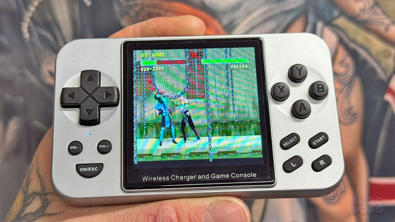 Mortal Kombat playing on a chrome handheld