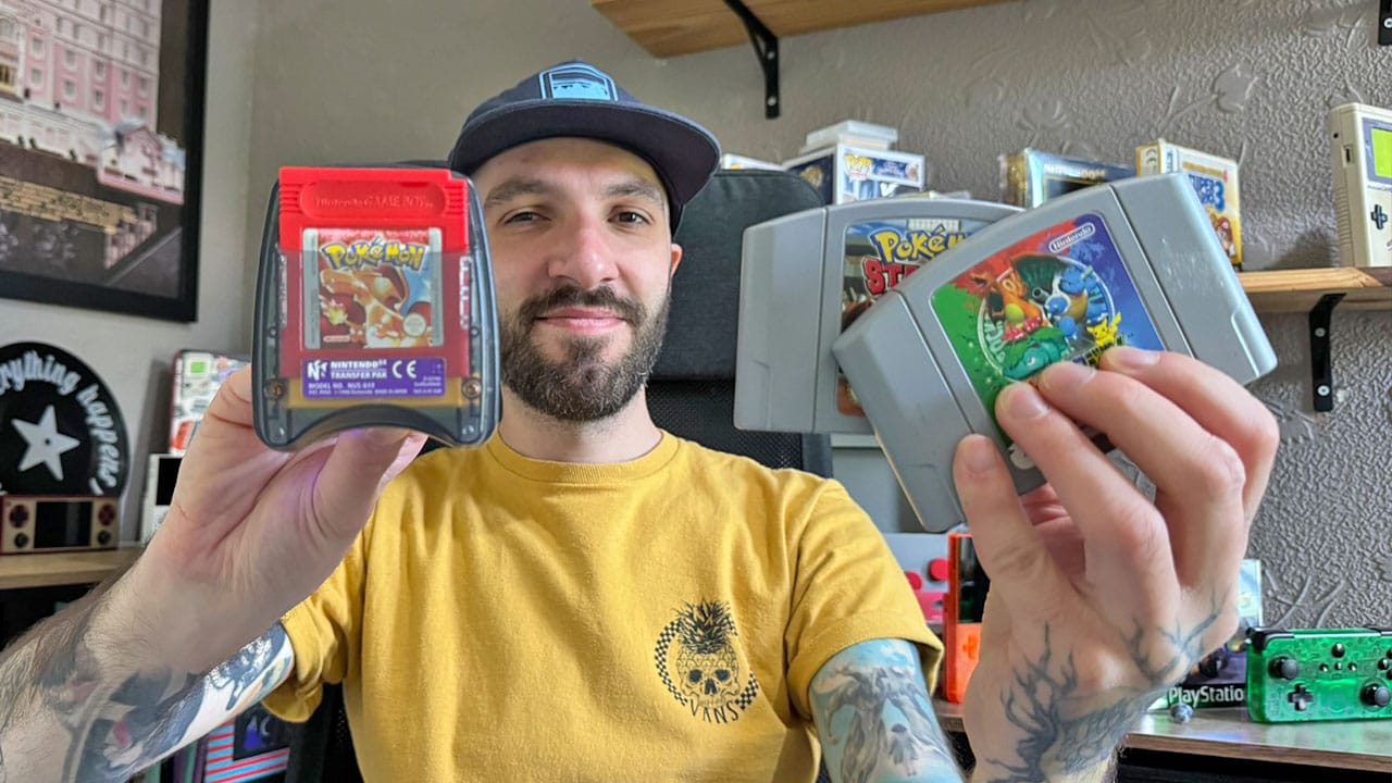 Seb holding Pokémon Stadium games and his transfer pak