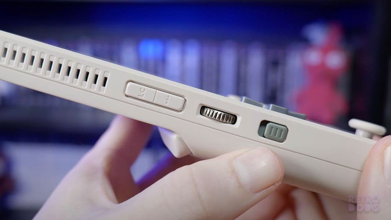 The volume wheel on the side of the handheld aswell as the LC button