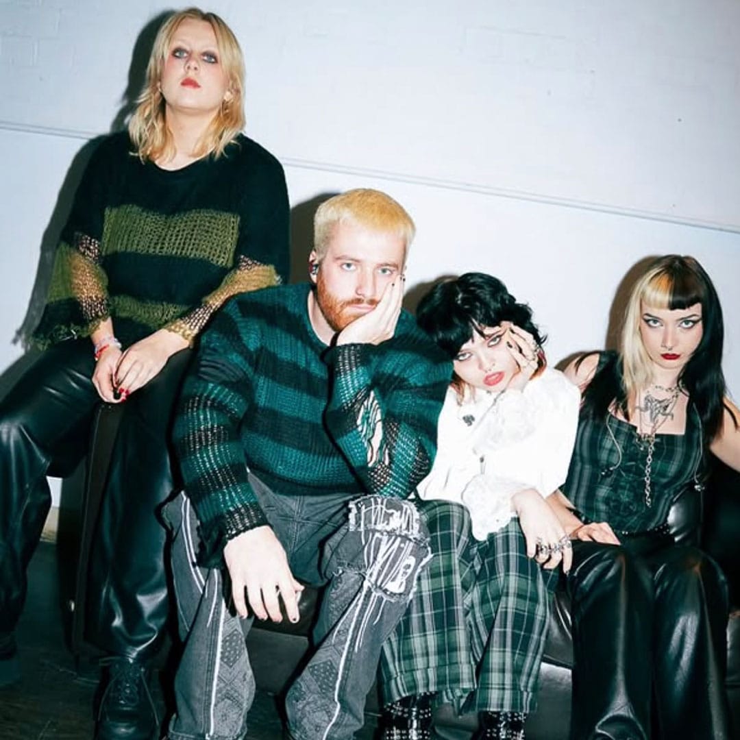 Crawlers sitting on a sofa back stage