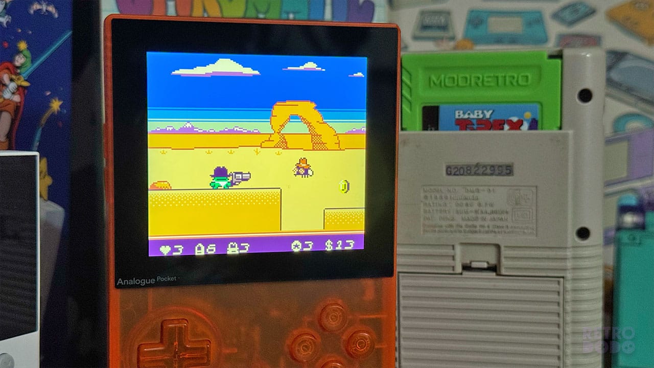 Kero Kero firing a bullet at an enemy - There is a Grey Game Boy in the picture behind.