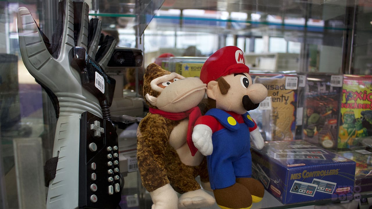 Donkey Kong ad Mario plushies with a Power Glove