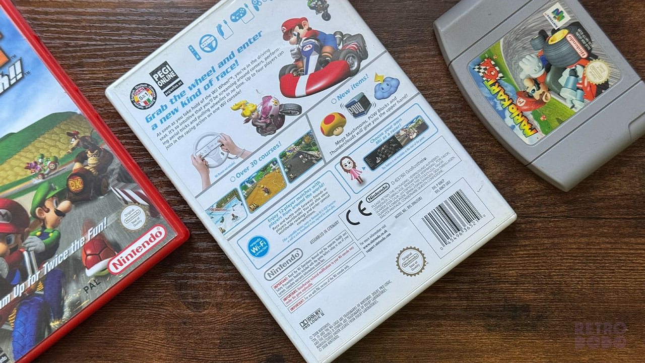 Mario Kart Wii box next to Double Dash!! and Mario Kart 64 cart